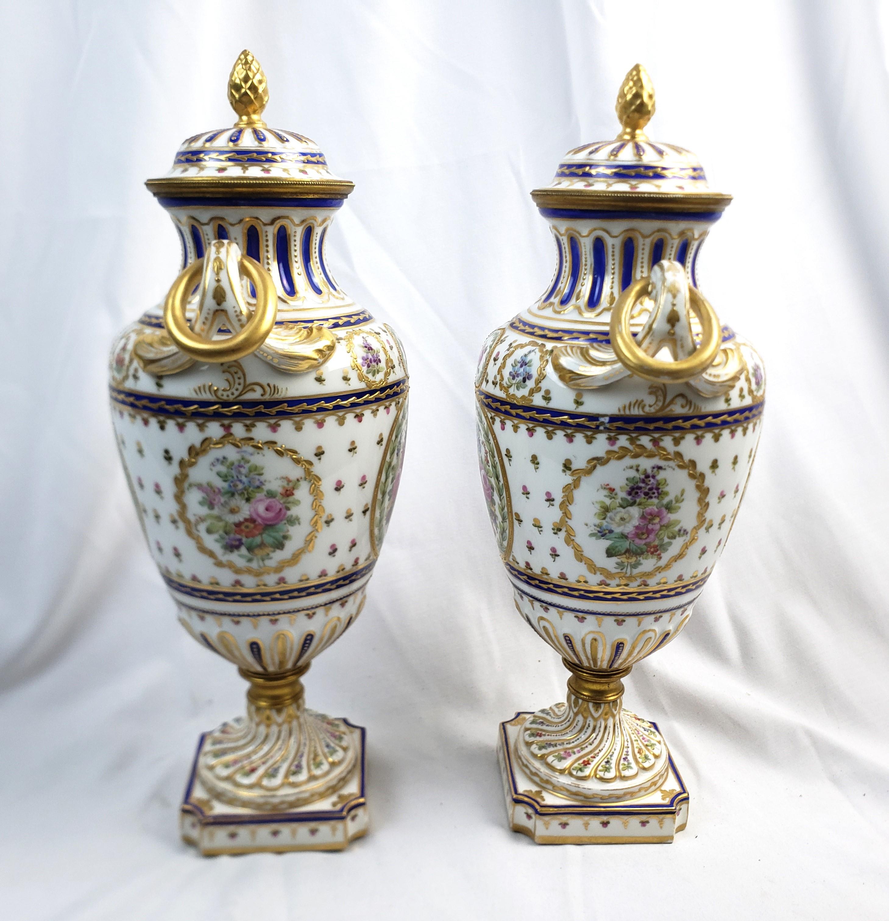 Glazed Pair of Antique Sevres Styled Covered Urns with Ornate Hand-Painted Decoration For Sale