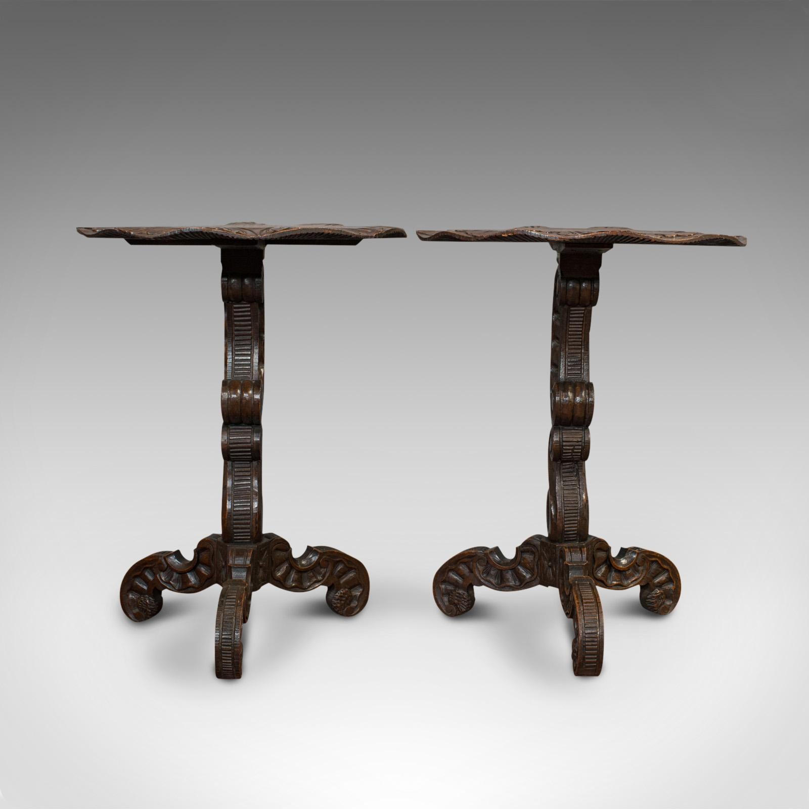 This is a pair of antique side tables. An Asian, Chinese elm carved occasional table or wine stand, dating to the late Victorian period, circa 1900.

Superb carved tables with Oriental appeal
Displaying a desirable aged patina
Chinese elm shows