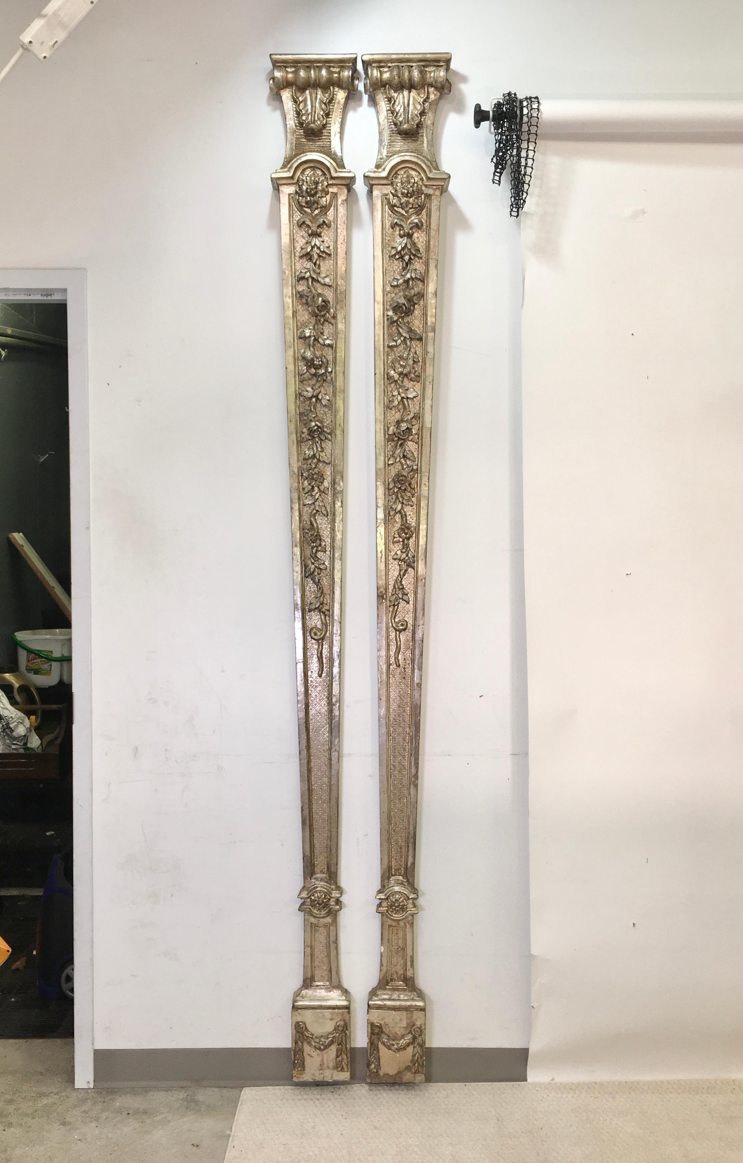 Pair of tall slender tapered pilasters, silver gilt, 8ft 8 inches tall, finely carved in the typical shallow relief manner of the Régence period. 
Gorgeous patina on silver gilding.. 
These have concentrated power to transform any room.