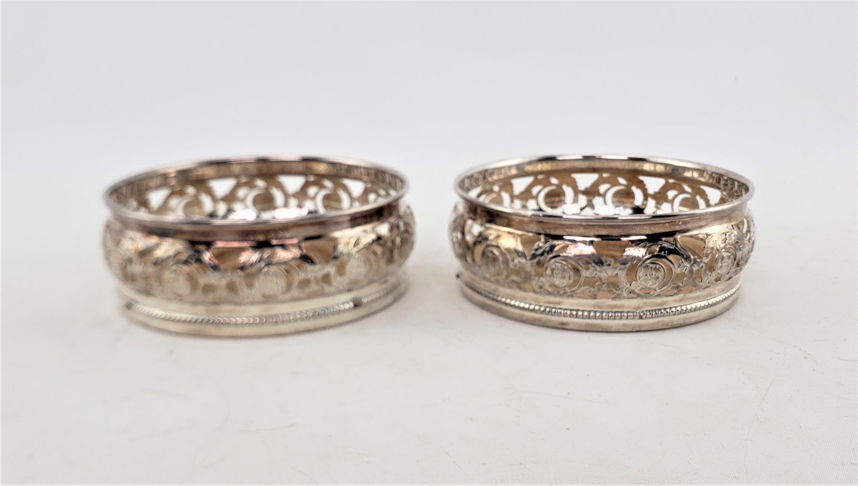Pair of Antique Silver Plated Bottle Coasters with Floral Engraved Pierced Sides In Good Condition For Sale In Hamilton, Ontario