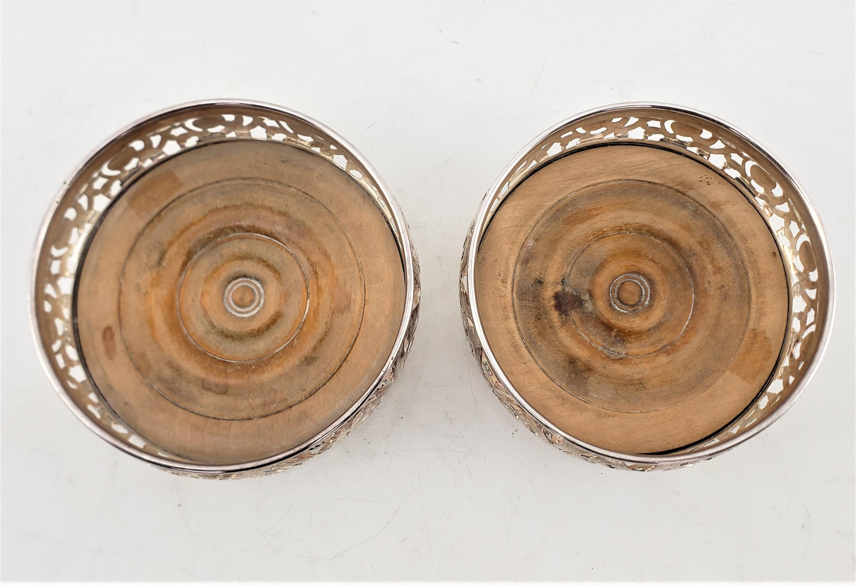 20th Century Pair of Antique Silver Plated Bottle Coasters with Floral Engraved Pierced Sides For Sale