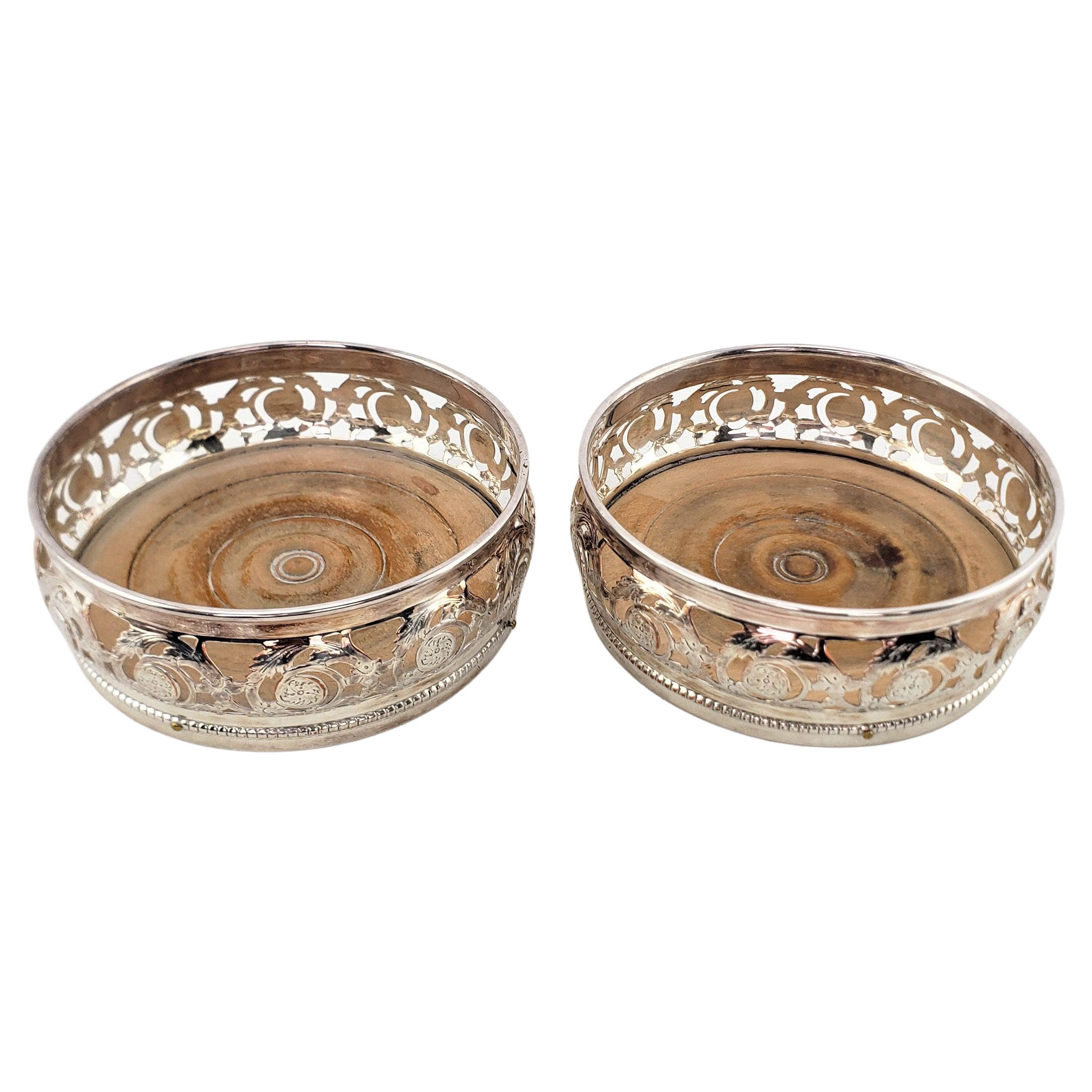 Pair of Antique Silver Plated Bottle Coasters with Floral Engraved Pierced Sides For Sale