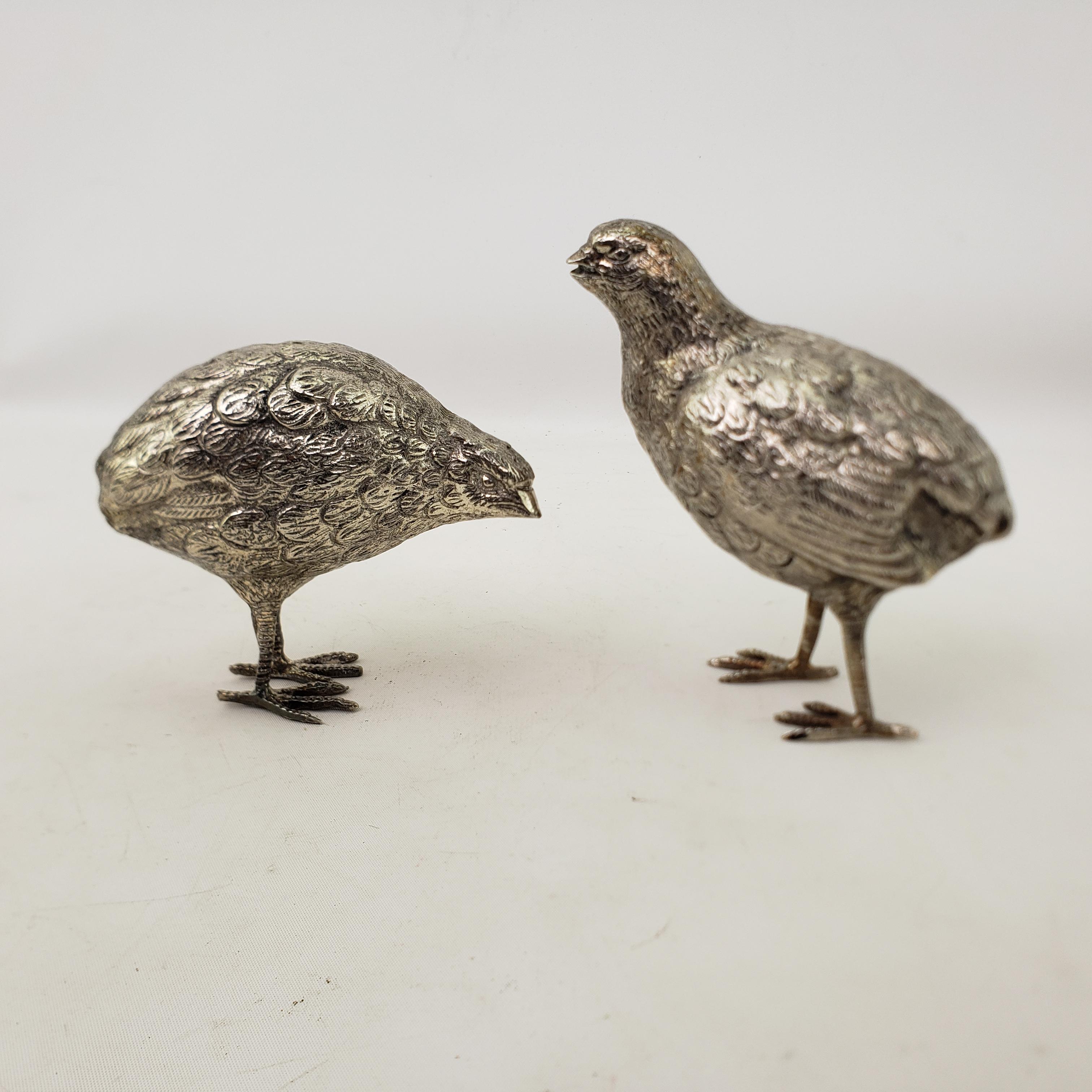 This pair of antique silver plated game birds are unsigned, but presumed to have originated from Europe, most likely Italy, and dating to approximately 1890 in the period Victorian style. The birds are figural silver plated quails, and are nicely
