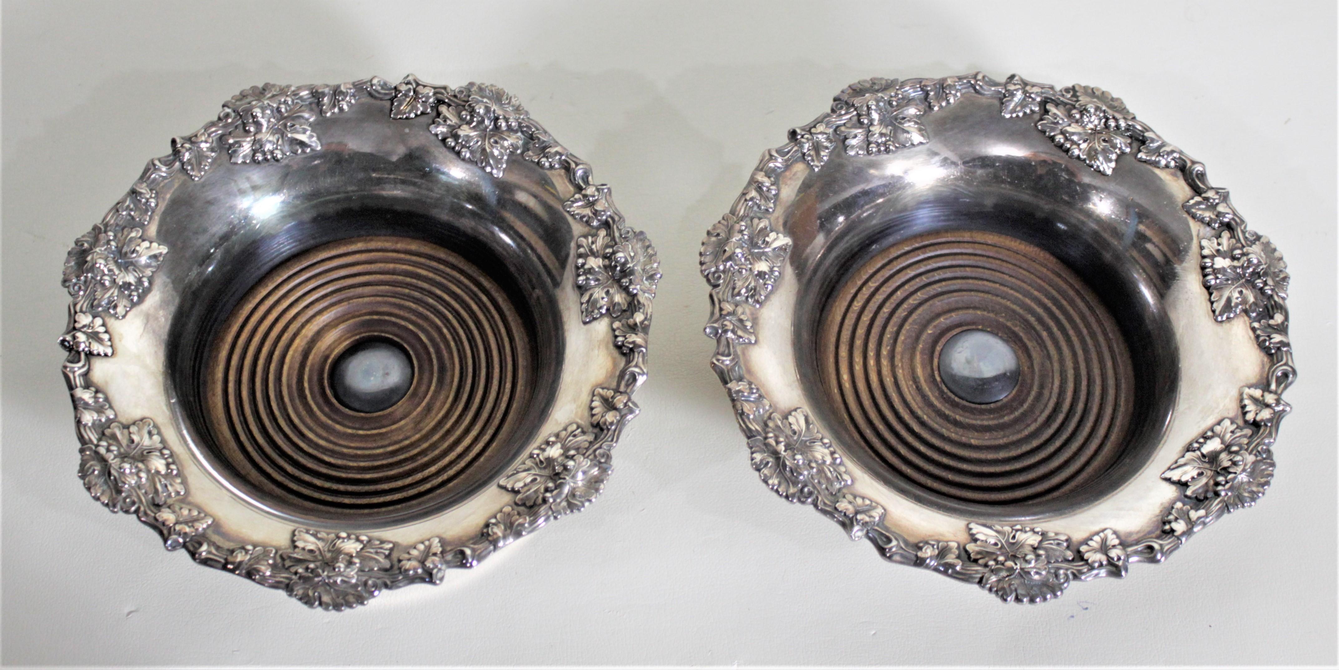 Edwardian Pair of Antique Silver Plated Wine Bottle Coasters with Leaf & Berry Decoration