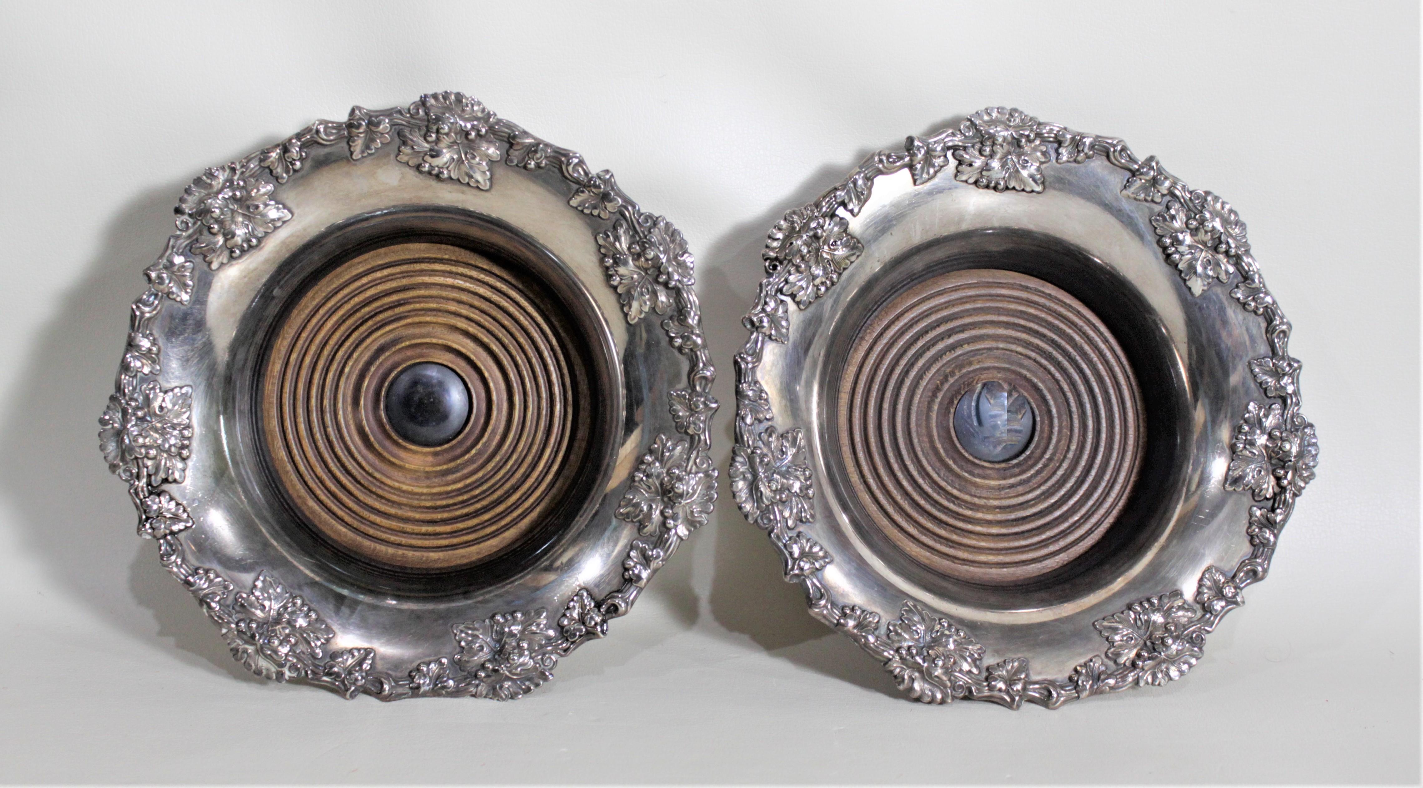 Pair of Antique Silver Plated Wine Bottle Coasters with Leaf & Berry Decoration In Good Condition In Hamilton, Ontario