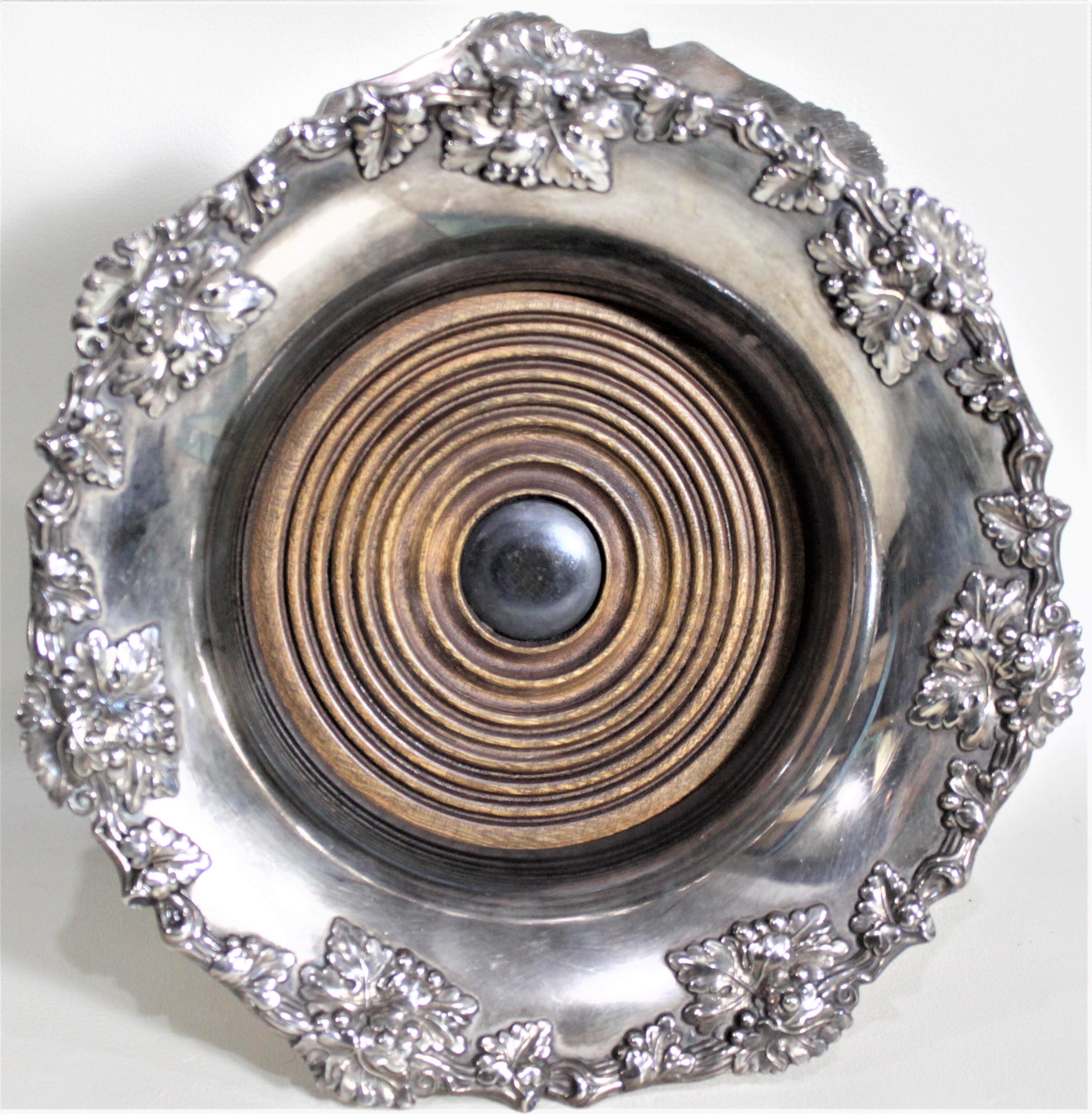 20th Century Pair of Antique Silver Plated Wine Bottle Coasters with Leaf & Berry Decoration
