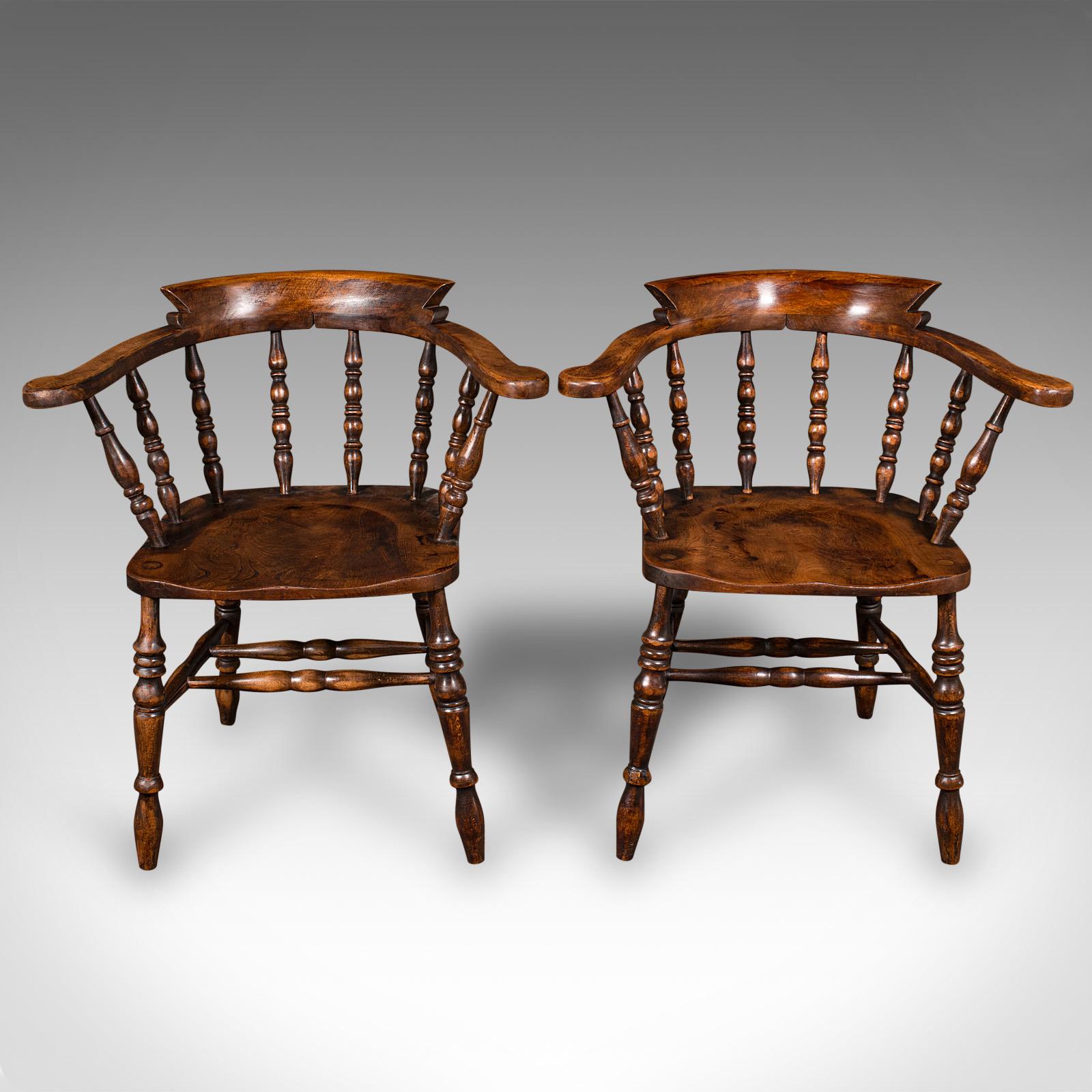 
This is a pair of antique smoker's bow chairs. An English, beech and elm captain's armchair, dating to the late Victorian period, circa 1890.

Excellent country house appeal with this pair of classic bows
Displaying a desirable aged patina and in