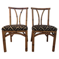 Pair of antique south seas bamboo chairs with polynesian hawaiian fabric