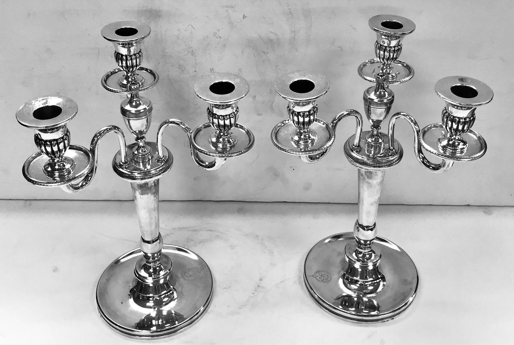 A magnificent pair of 3-light antique Spanish silver candelabra,
made by the Royal Silversmith, Antonio Martinez, and hallmarked, Madrid 1819.
The candelabra are cast silver and weigh 3175gms.
The branches are removable in order to use as single