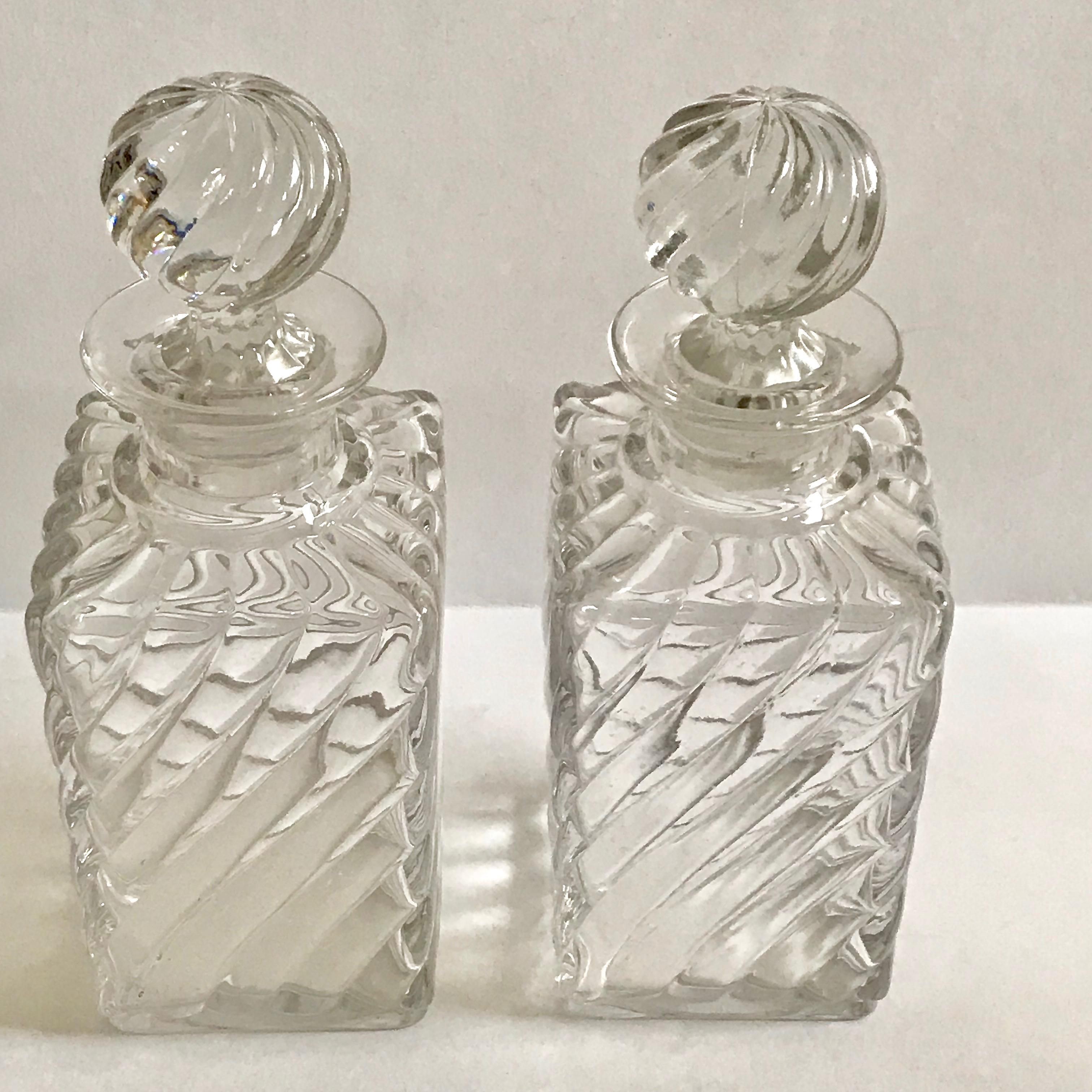 Pair of French antique large square base crystal Baccarat perfume bottles in a swirled bamboo pattern.
Original lid.
Measures: Height 19.50 cm
Depth 7.00 cm
Width 7.00 cm.