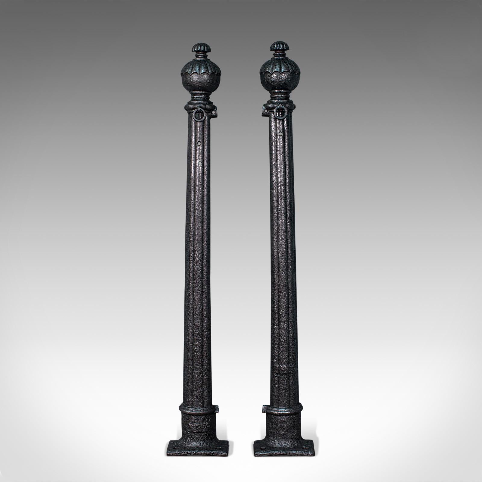 This is a pair of antique stable yard hitching posts. An English, cast iron equestrian architectural column, dating to the Georgian period, circa 1750.

Captivating pair of early Georgian horse tethering posts
Displaying a desirable aged patina