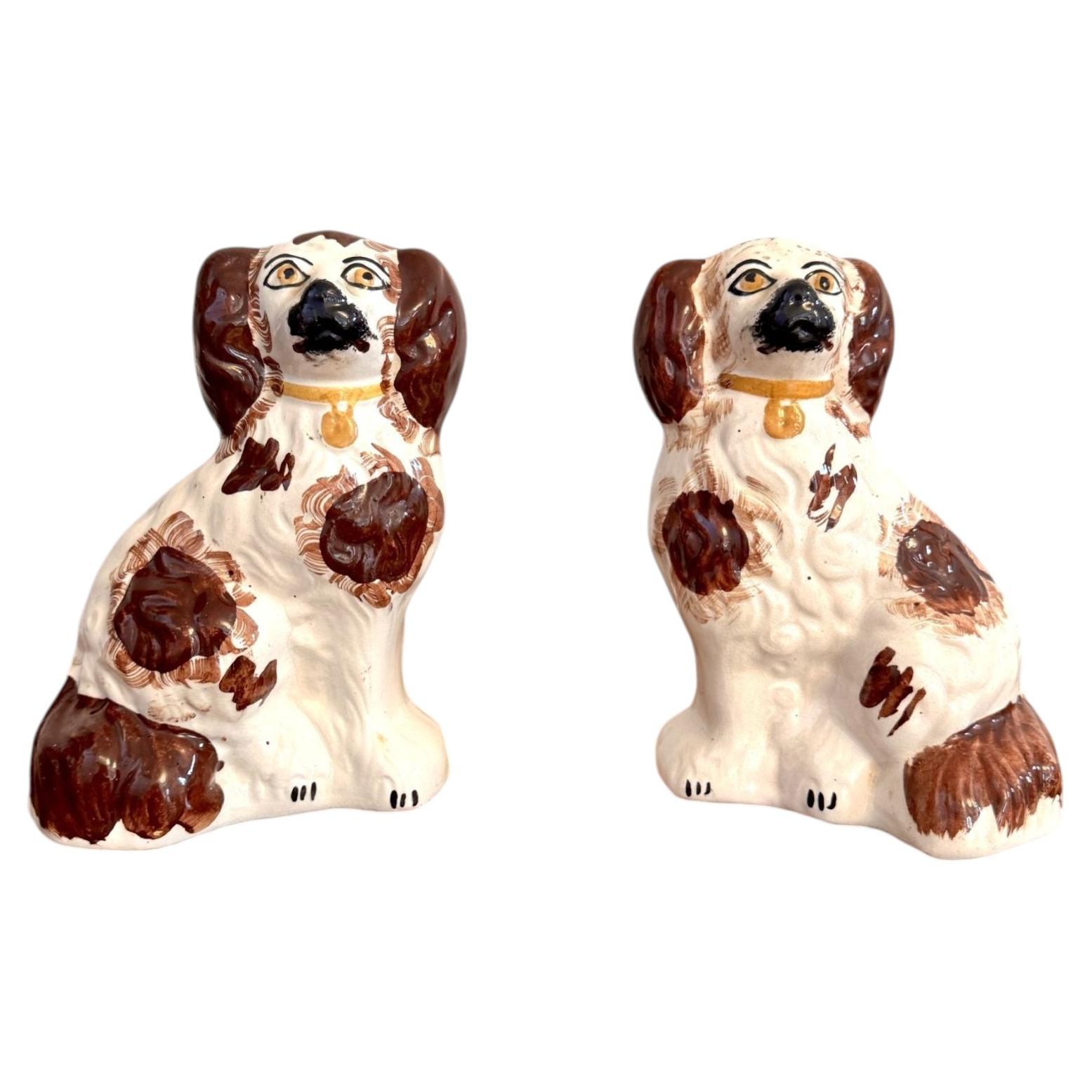 Pair of antique Staffordshire dogs