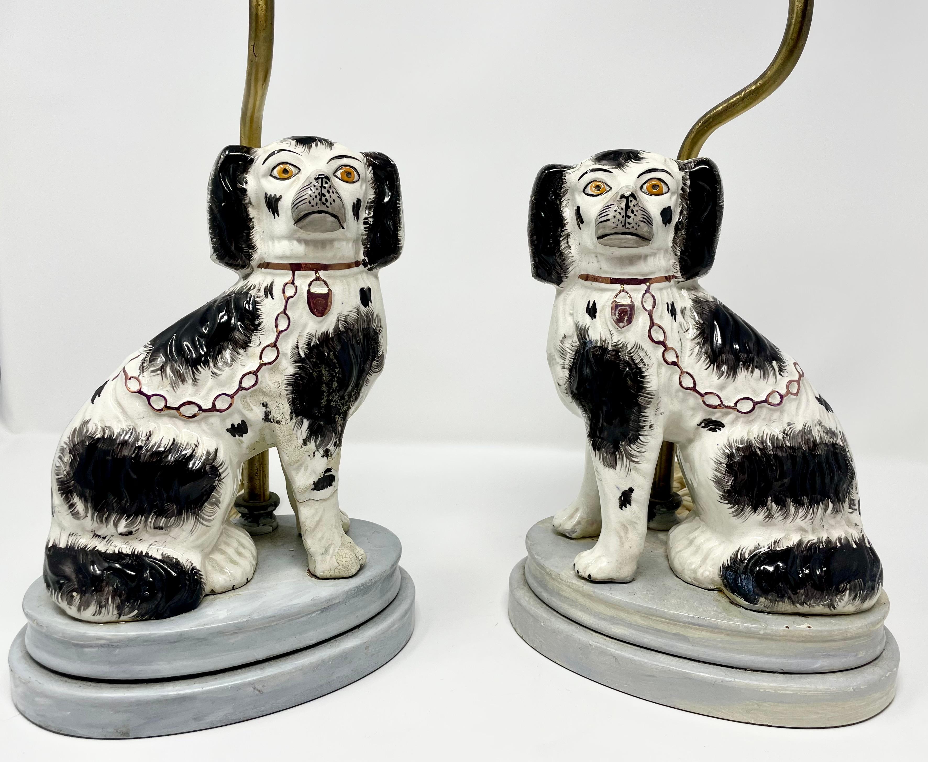 Pair of antique Staffordshire Spaniels converted lamps, circa 1880.