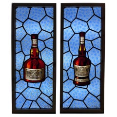 Paire de panneaux publicitaires anciens en verre teinté pour liqueur