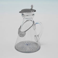 Pair of antique sterling silver whiskey tots with whiskey labels made in 1925