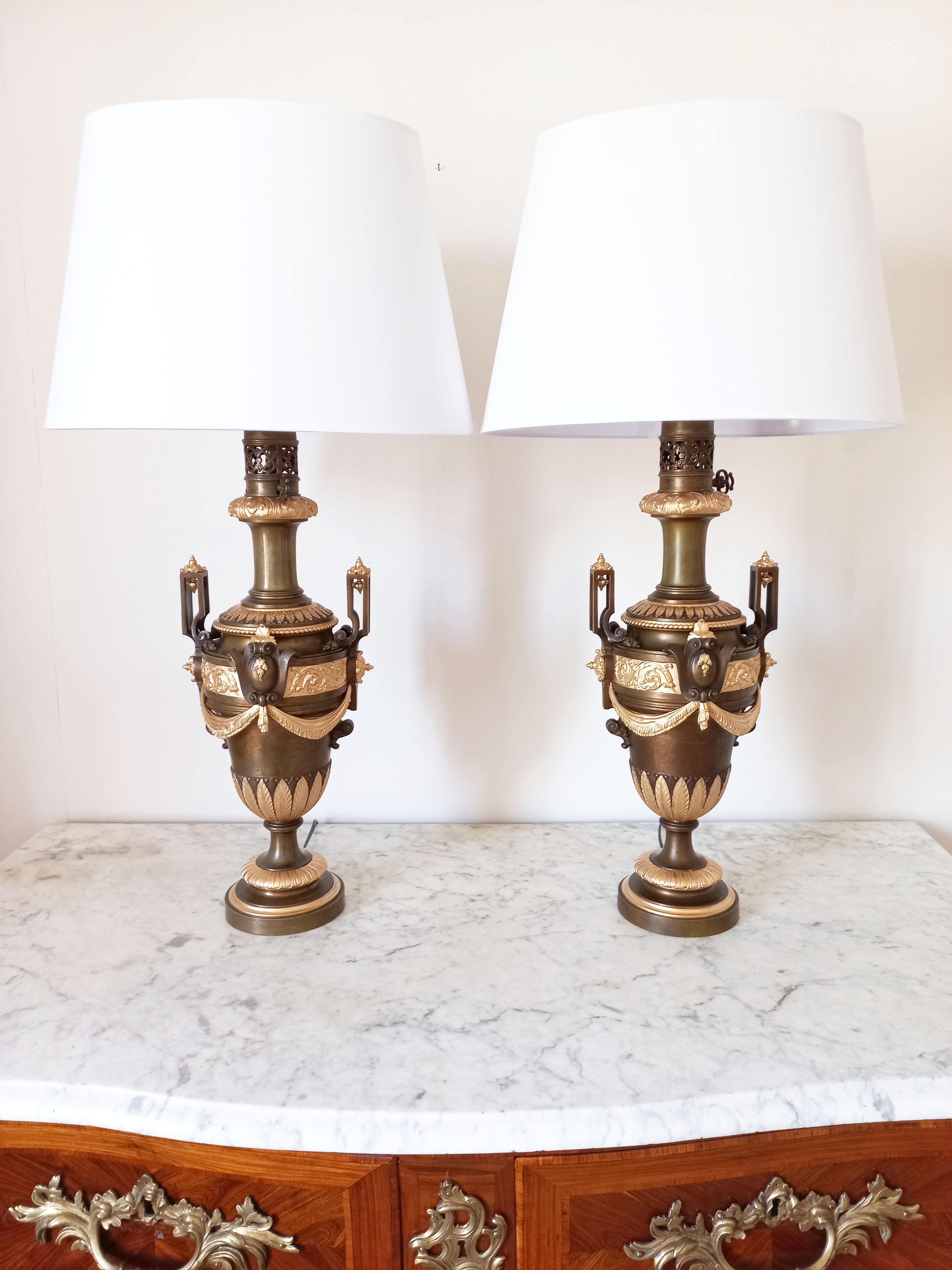 Pair of Antique style lamps in patinated and gilded bronze. Richly decorated with golden motifs. France, late 19th century period. Electrification redone, several lights will be provided. They are in very good condition, and spectacular.
the