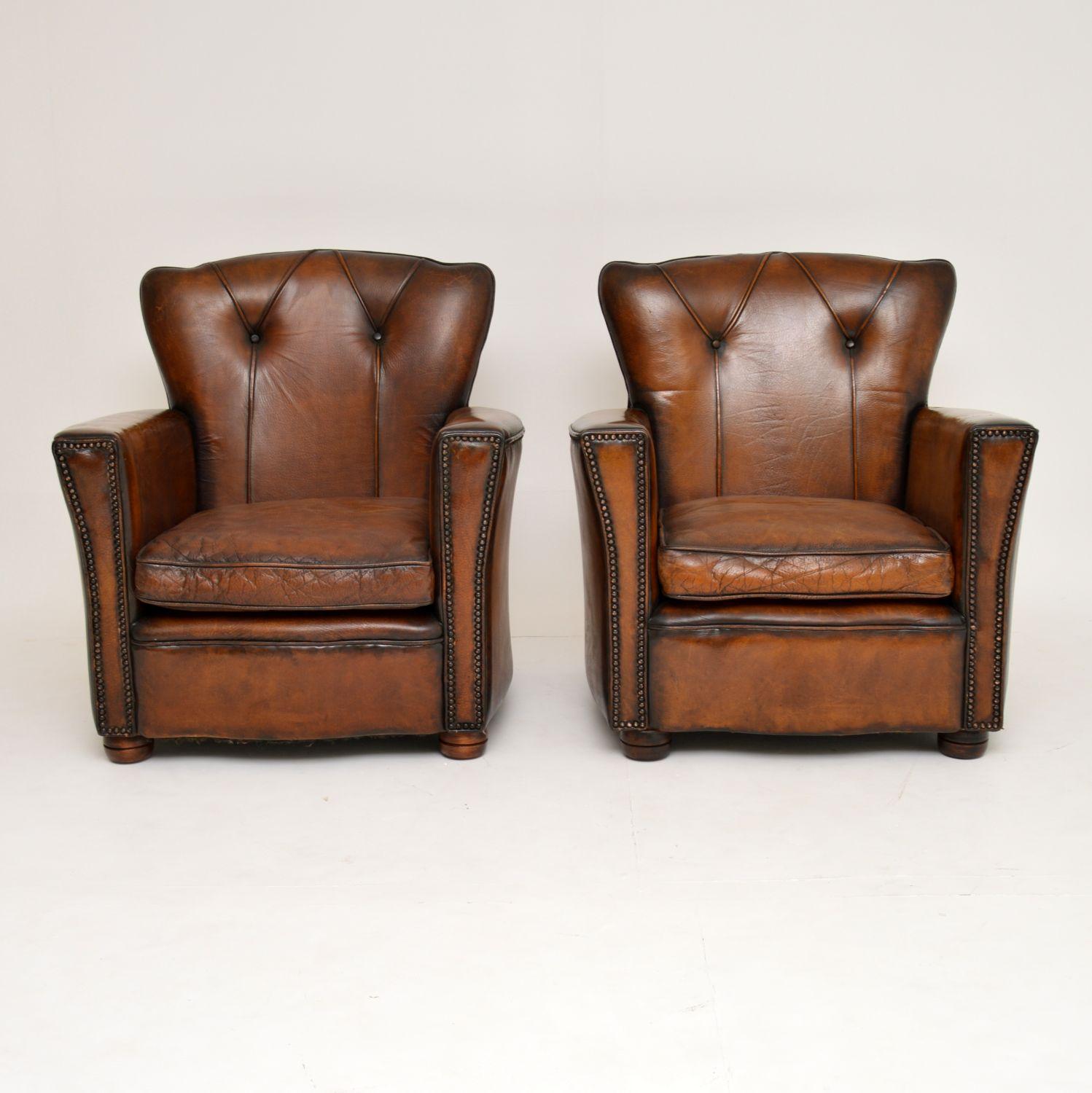 Pair of antique style vintage leather club armchairs in good original condition and with plenty of character.

The leather is in good condition with no rips or holes and has just been professionally cleaned and polished by our leather