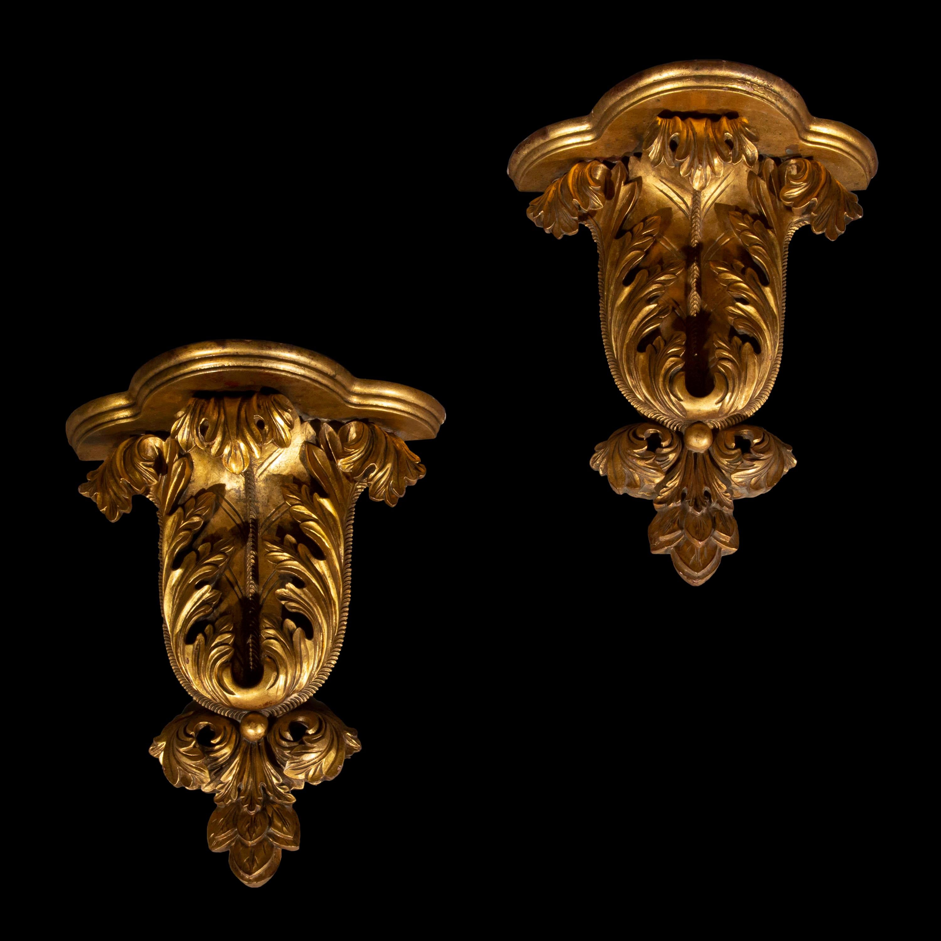 A decorative pair of carved and gilded wood wall brackets in the William Kent Baroque taste, shaped as roman acanthus foliage,
early to mid-20th century.

Why we like them
Boldly sculpted in the manner, evoking the decoration in ancient Rome,