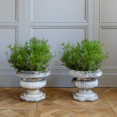 Pair of Antique Style Weathered Stone Campana Urn Planters