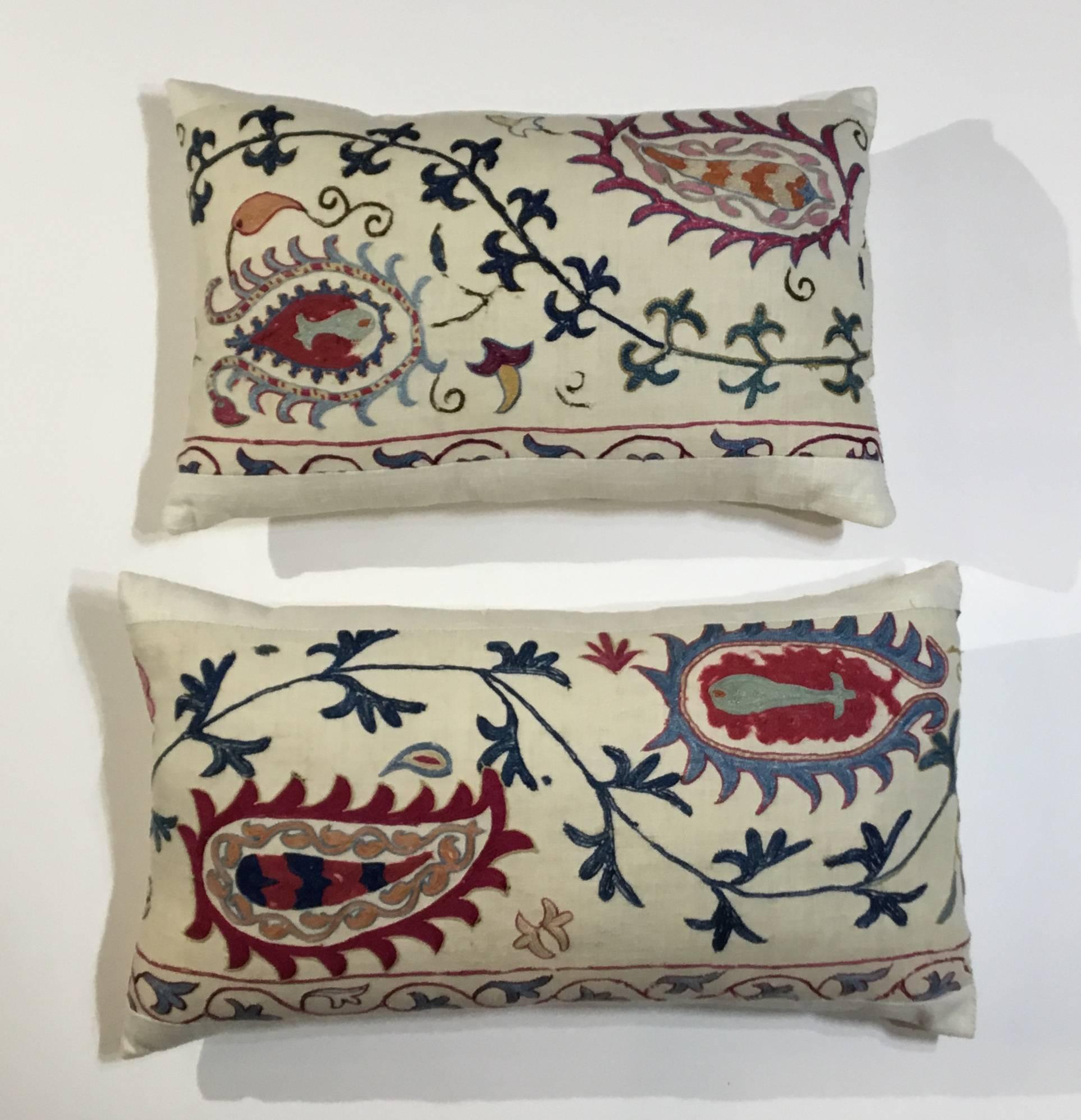 Fantastic pair of pillows made of antique hand embroidery Suzani textile, beautiful vine and flowers motifs. Fresh insert, silk backing. Some missing embroidery due to age and oxidization,
great decorative pillows.
Size: 22”.5 x 12”
18”.5 x 11”.5.