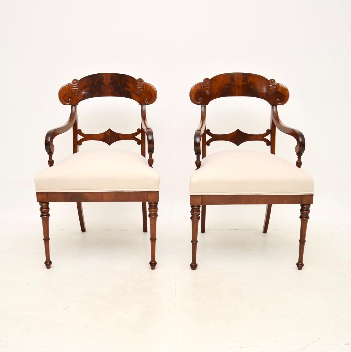 A stunning pair of antique Swedish armchairs. They were recently imported from Sweden, they date from around the 1850-1870 period.

They are of extremely fine quality, with beautifully carved details, finely turned legs and gorgeous flame grain