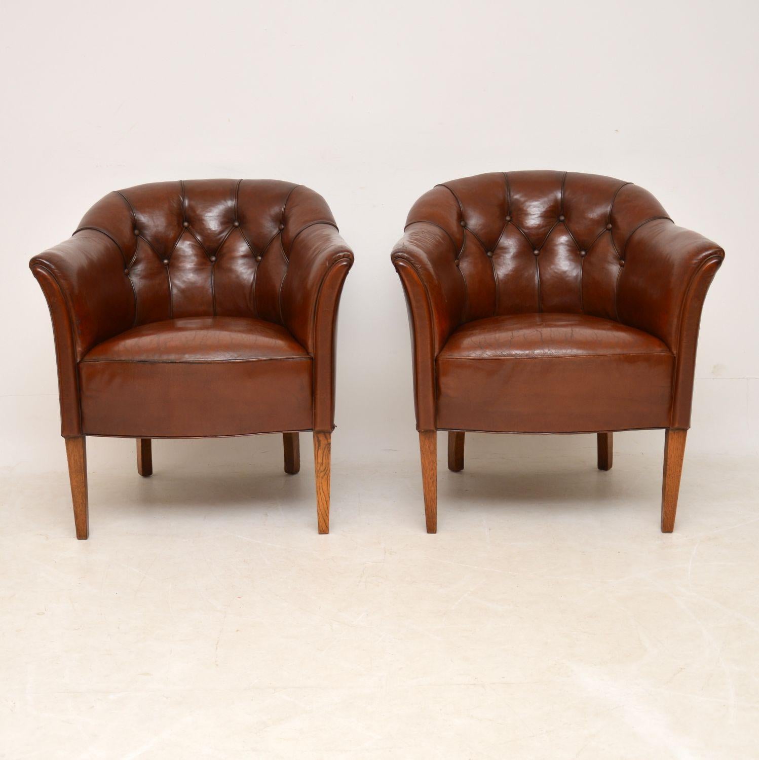 Fabulous pair of original antique Swedish leather armchairs with deep buttoned backs and in excellent condition, dating to circa 1910 period. They have fully sprung seats and curved backs, so are very comfortable. These chairs have just come over