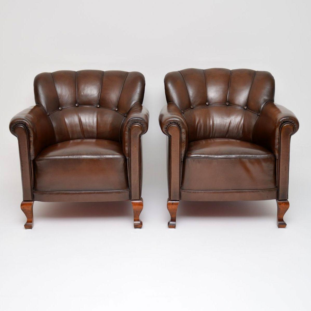 Pair of antique Swedish leather armchairs in great original condition with satin birch legs. The brown leather is naturally aged with lots of character and there are no rips, splits or holes. The inside backs are ribbed and deep buttoned. They are