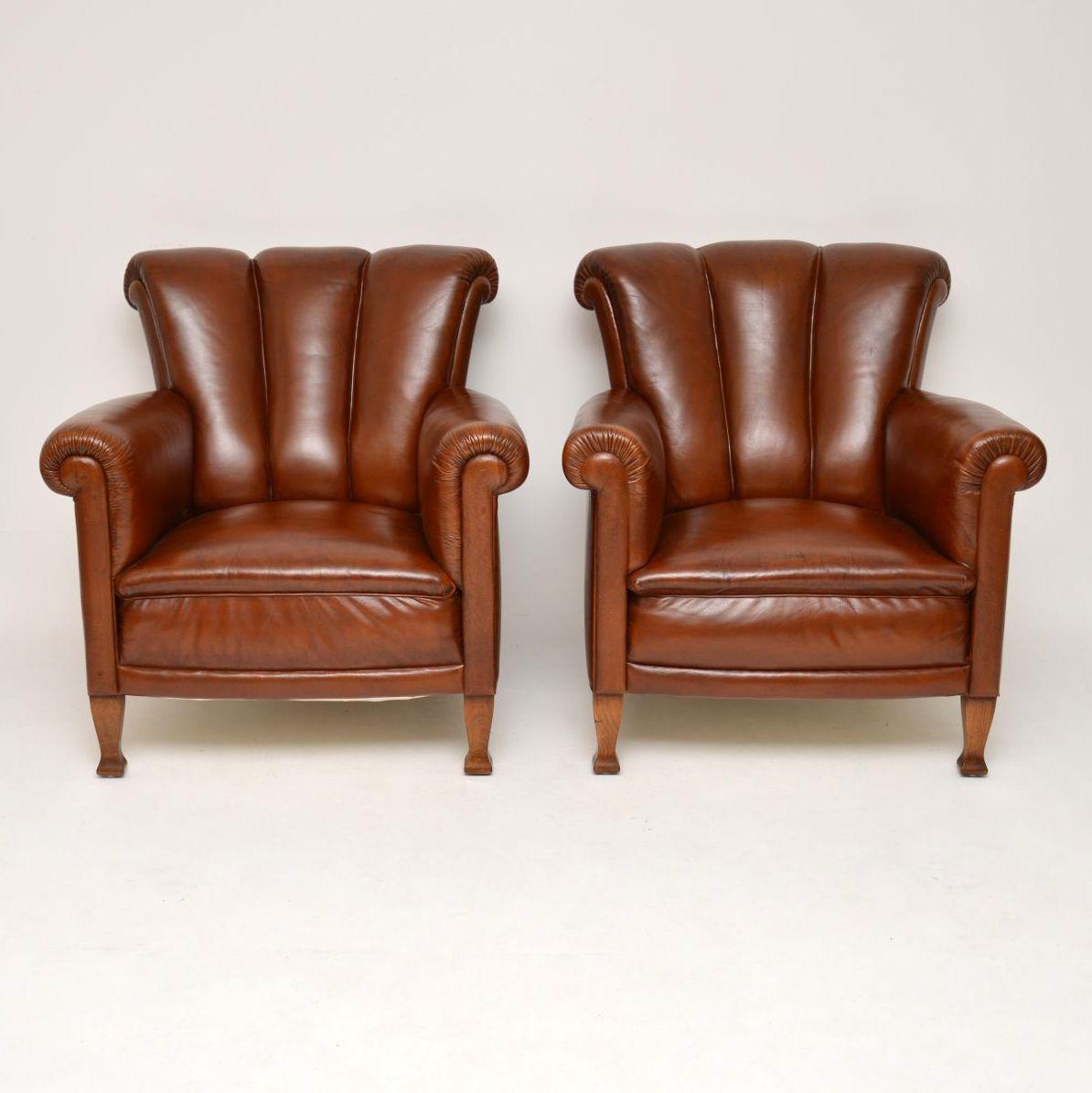 Very comfortable and stylish pair of antique Swedish leather armchairs in excellent condition. They date from circa 1910 period and they have just come over from Sweden. These armchairs have very supportive fluted roll over backs and the seats are