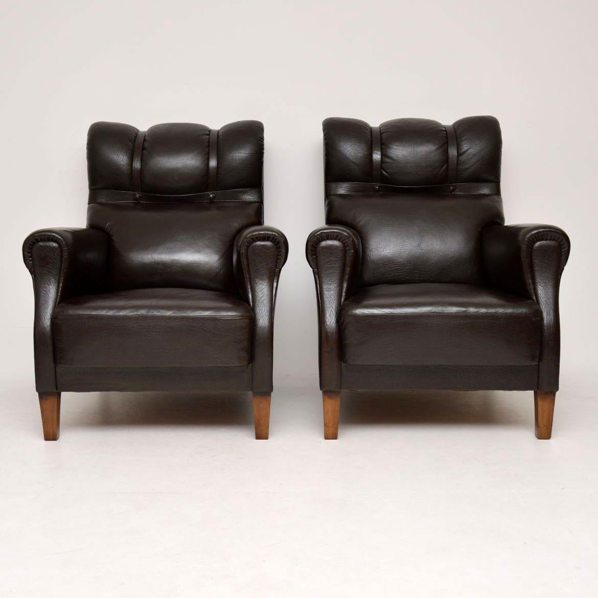 This pair of antique leather Swedish club armchairs have great character & are very comfortable too. The leather is all original along with leather straps & studs. I love the original color on the leather that has naturally aged. The leather is