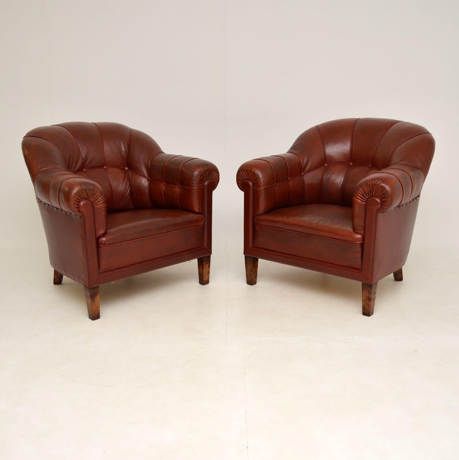 A stunning and extremely comfortable pair of antique leather club armchairs. These were made in Sweden, they date from the 1900-1910 period.

The quality is amazing, these are extremely well built and heavy. We have had the burgundy leather hand