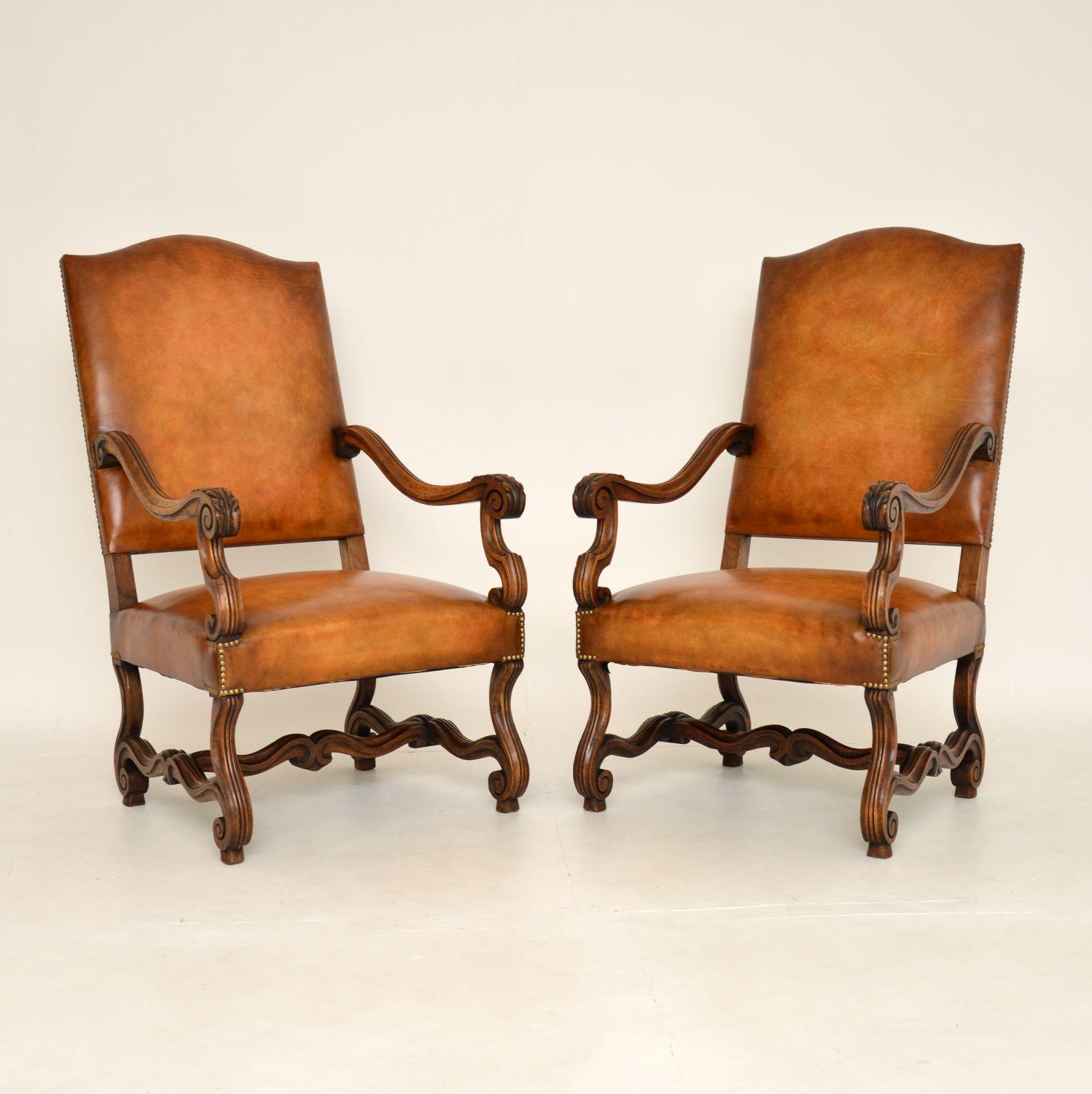 A superb pair of antique Swedish armchairs in solid walnut and leather. They are in the antique Carolean style, and they date from around the 1880-1900 period.

They are of amazing quality, and have a stunning design. The scroll over arms have