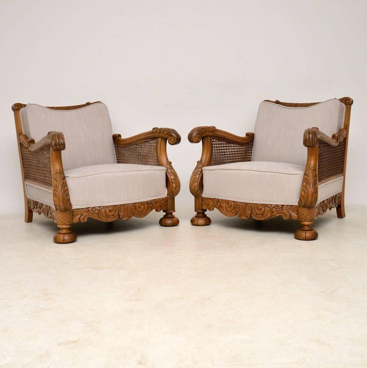 Very impressive pair of antique Swedish bergère armchairs with superbly carved oak frames, cane sides and of generous proportions. They are in excellent condition, having just been polished and re-upholstered and they have just come over from