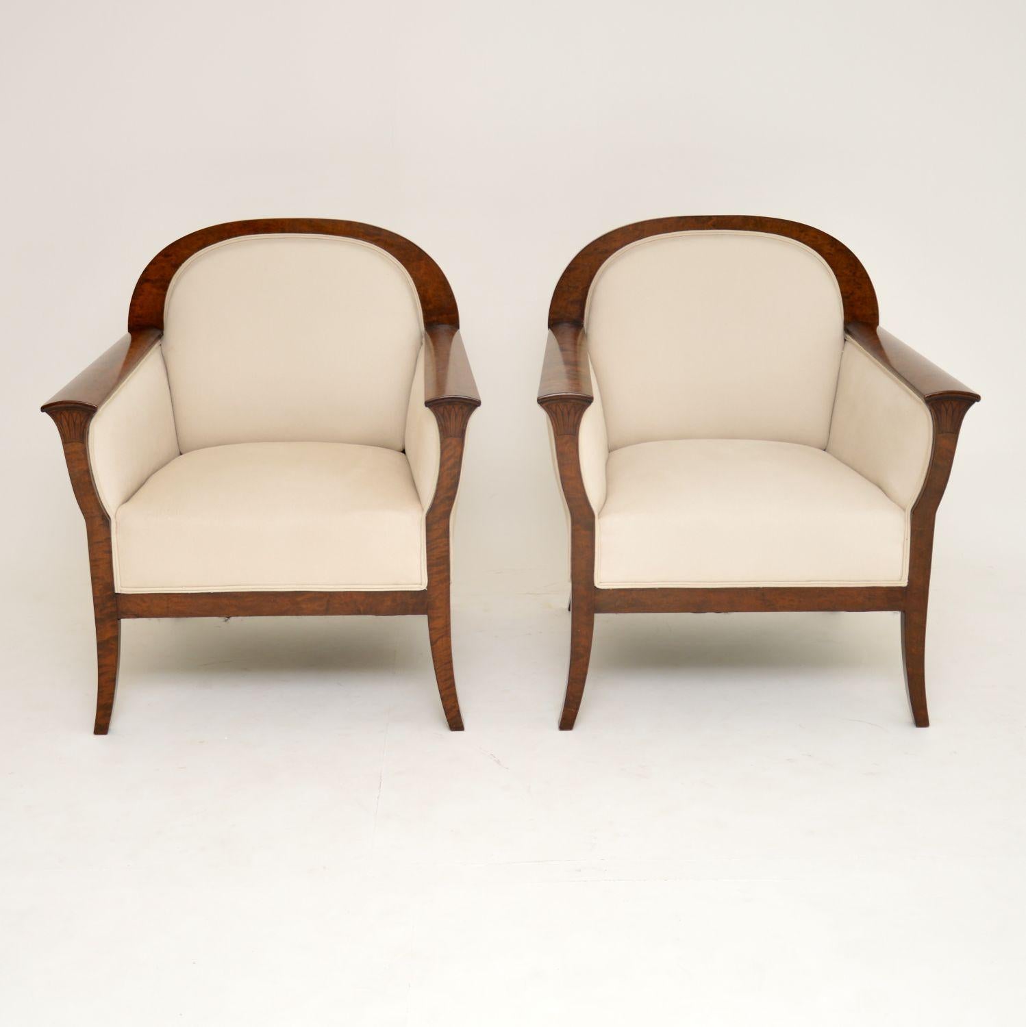 Very stylish pair of antique Biedermeier style Swedish upholstered armchairs with satin birch show wood frames. These armchairs which have just come over from Sweden, have been re-polished & re-upholstered in our regular cream natural cotton linen