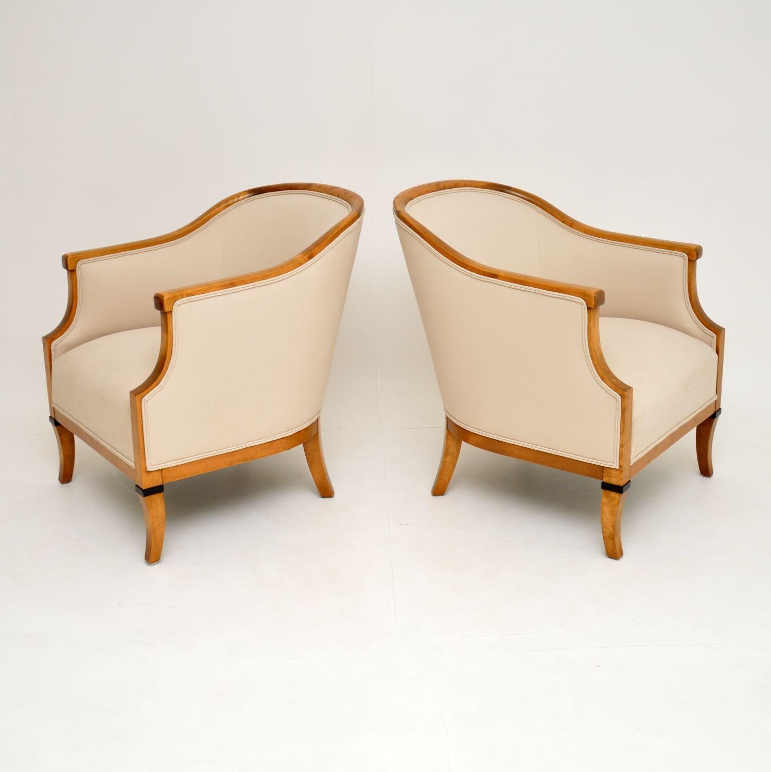 A stunning pair of antique Swedish armchairs made from Satin Birch. These date from circa 1910-1920 period, they are extremely well made.

We’ve just had the frames French polished, and they have been newly upholstered in our lovely cream fabric.