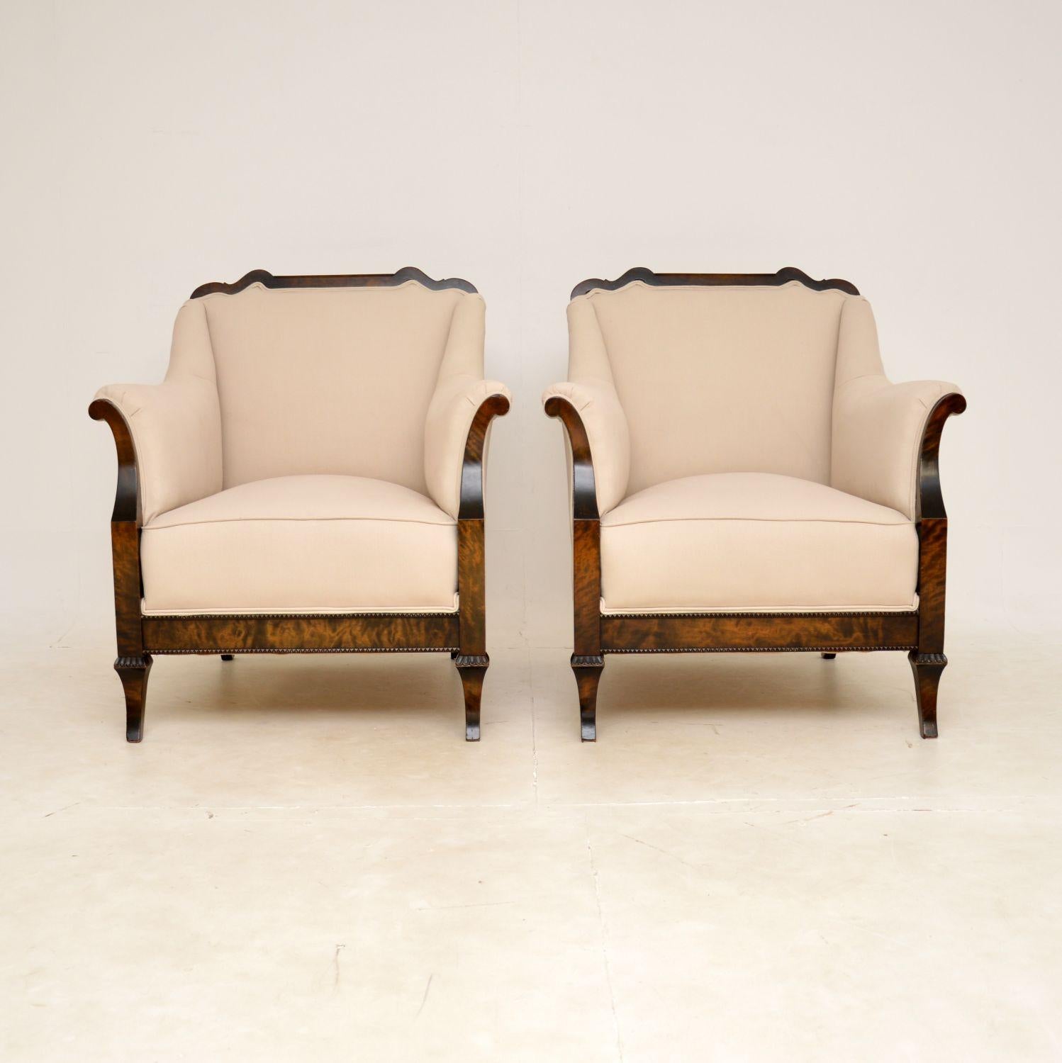 A large and impressive pair of antique Swedish armchairs in satin birch. They were recently imported from Sweden, they date from around the 1900-1920 period.

The quality is outstanding, they are generous, well sprung and very comfortable. The