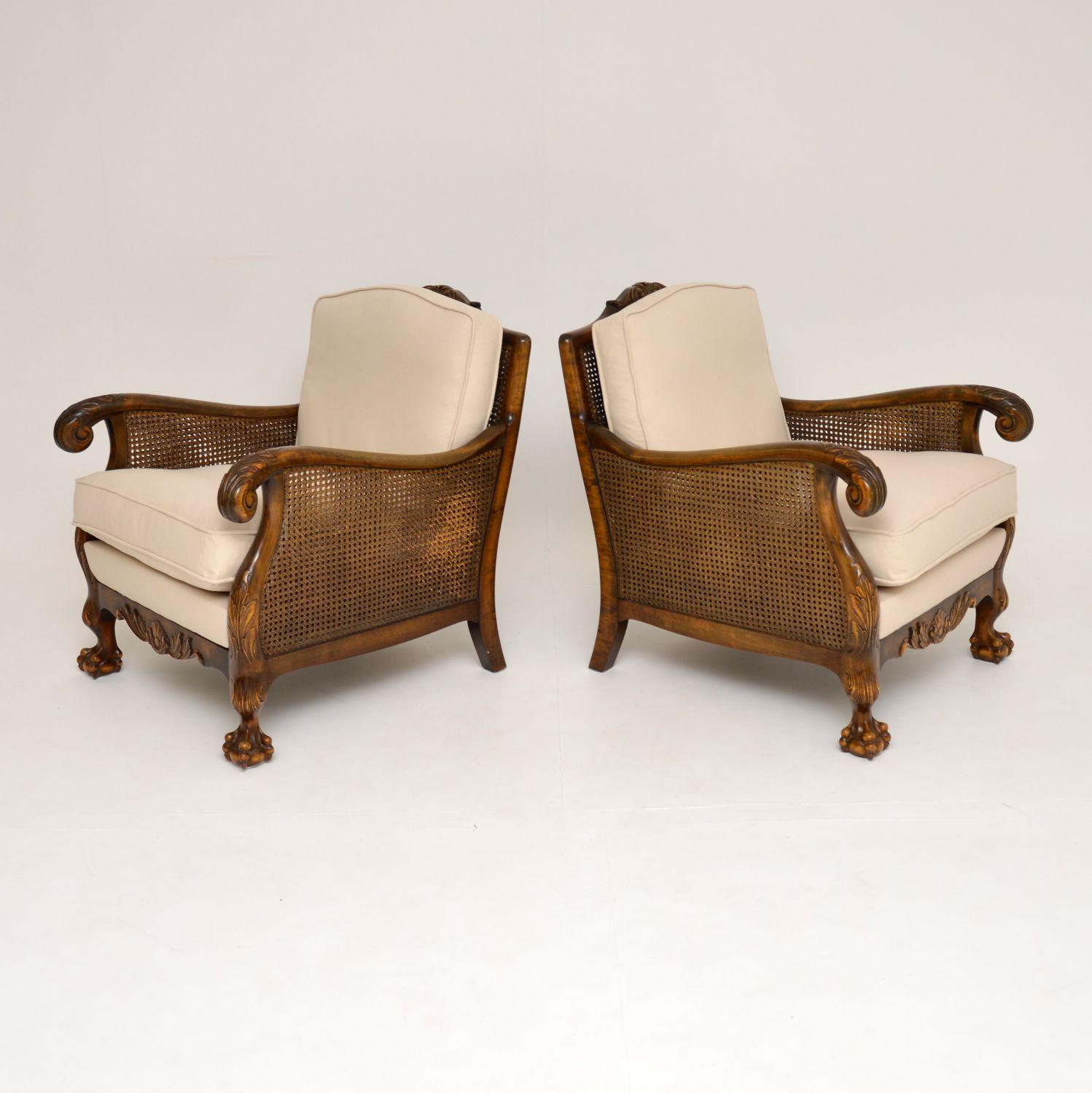Pair of antique Chippendale style Swedish satin birch bergère armchairs in excellent condition and dating to circa 1920s-1930s period.

These armchairs have beautifully shaped frames and detailed carvings all over. They are double caned on the