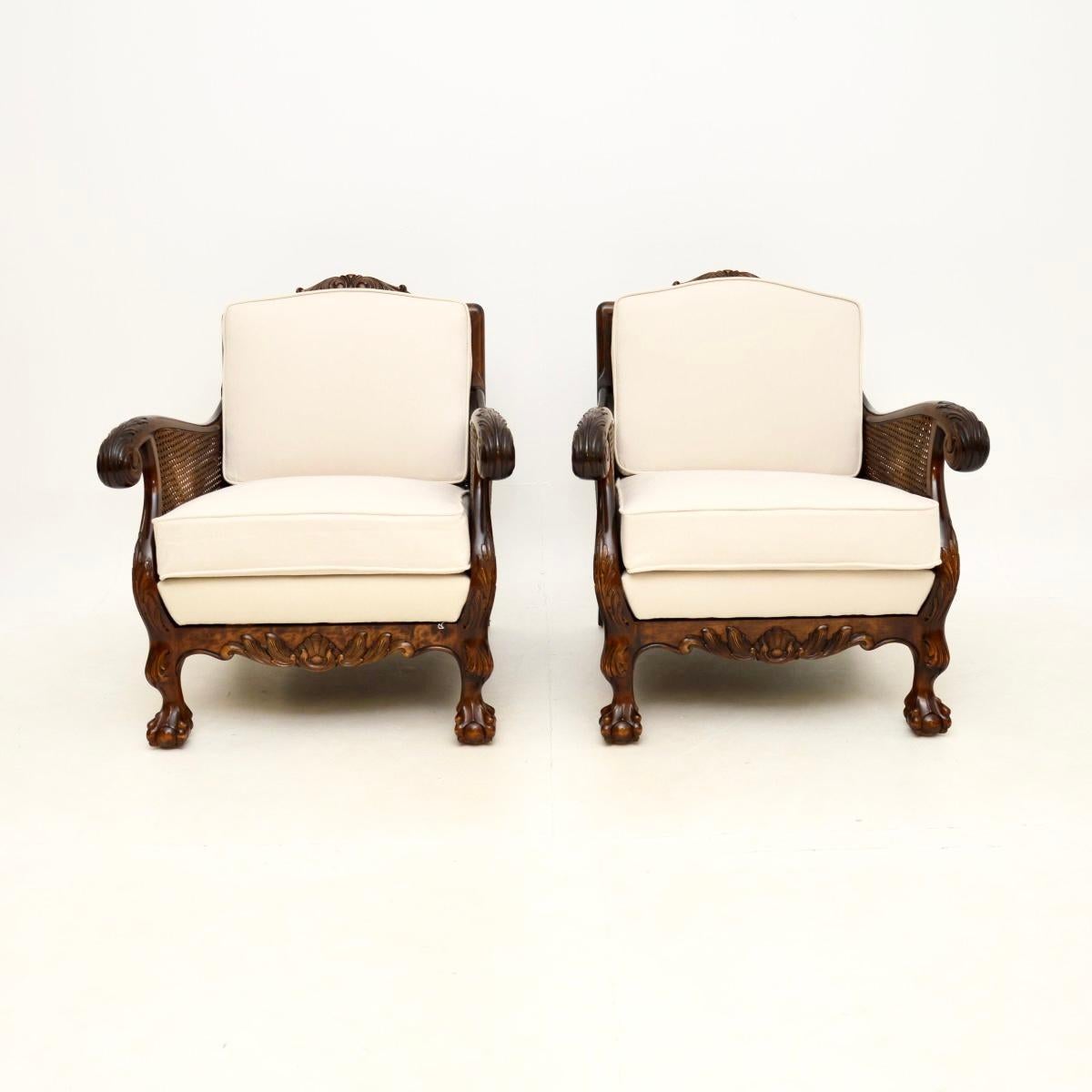 A beautiful pair of antique Swedish satin birch bergère armchairs in the Chippendale style. They were recently imported from Sweden, and they date from around the 1920-30’s period.

They have beautifully shaped frames and detailed carvings all over.