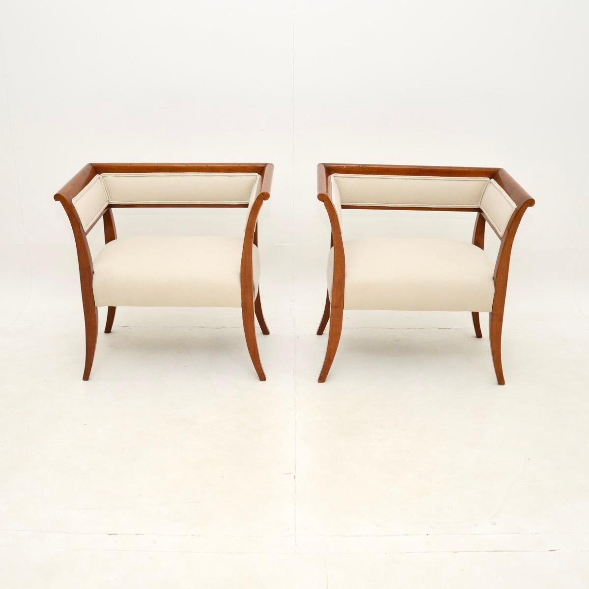 A stunning pair of antique Swedish satin birch Biedermeier armchairs. They were recently imported from Sweden and date from around the 1870-1890 period.

They are of superb quality, with a beautiful and refined design. They are quite petite, and
