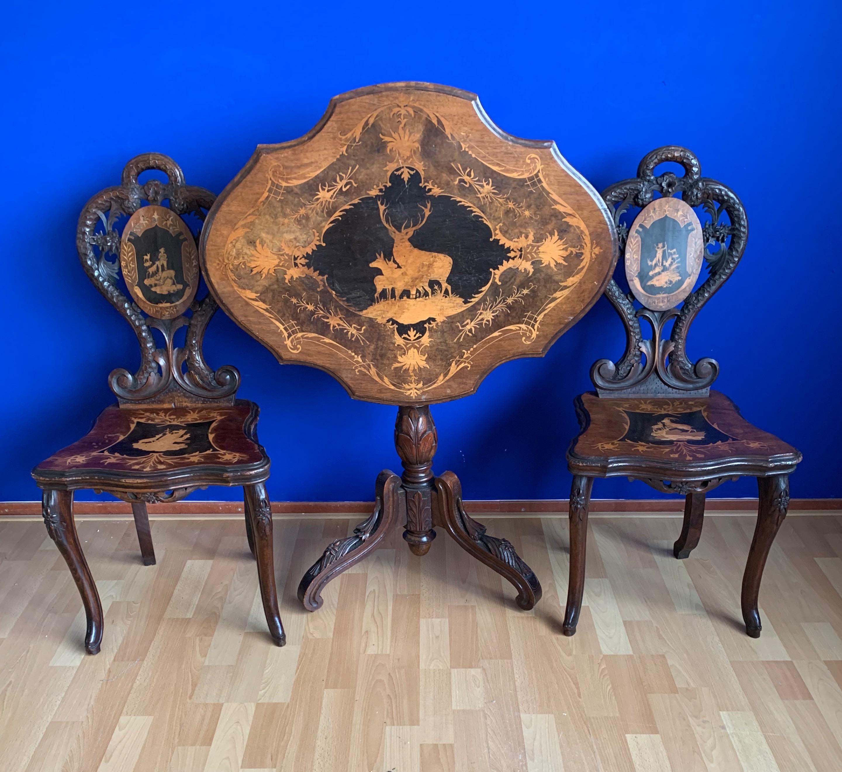 Stunning hand carved Black Forest hall set with marquetry inlay.

These very well crafted pieces of Black Forest furniture are an incredible sight to see. The workmanship and the large amount of finest details make this set highly decorative and an