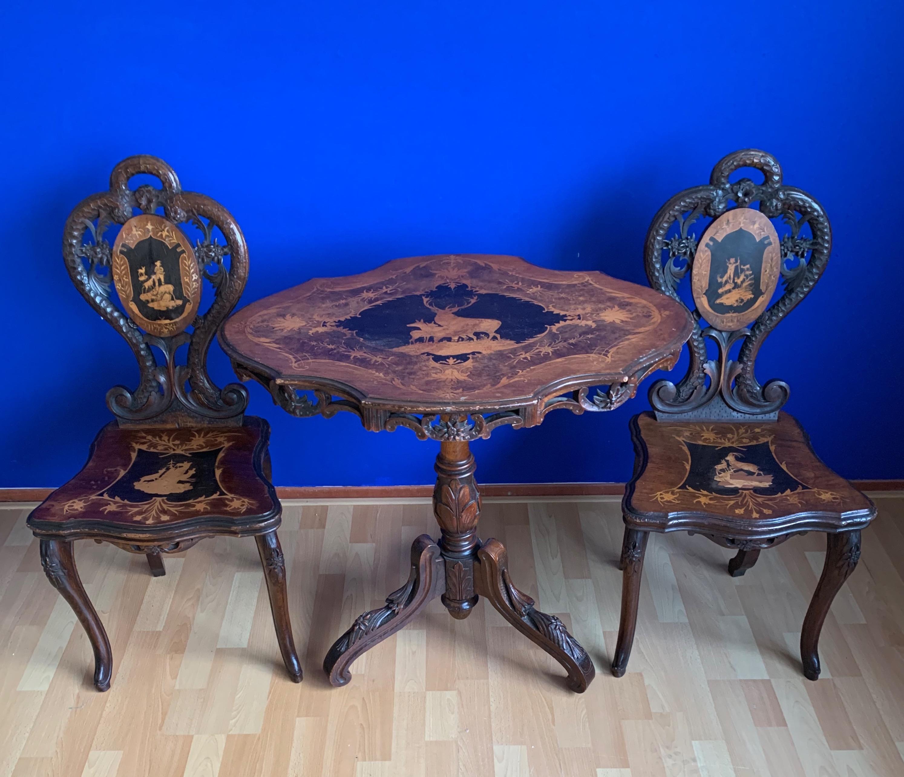 Wood Pair of Antique Swiss Black Forest Chairs w. Matching Tilt-Top Table, Late 1800s For Sale