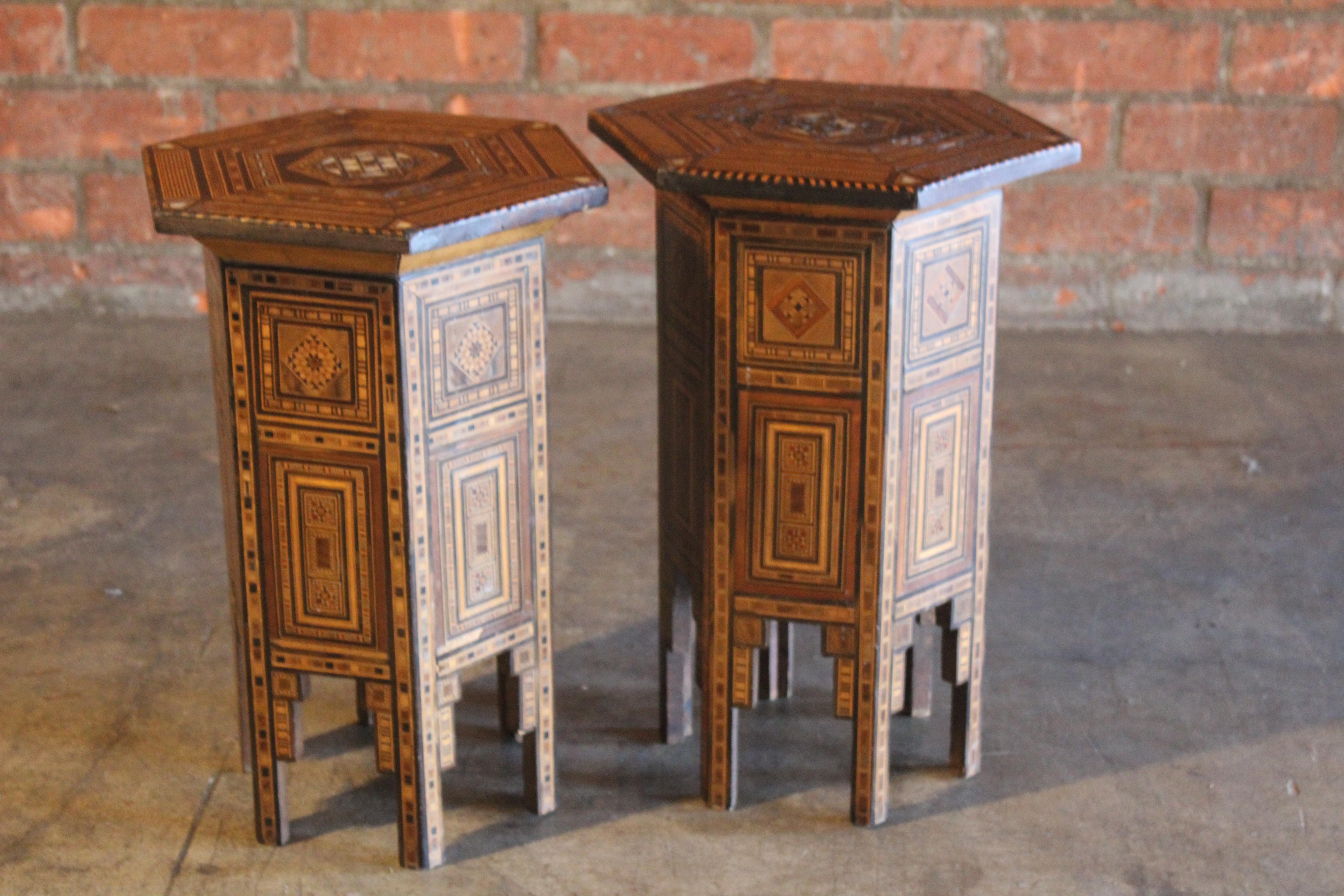Pair of antique 19th century Syrian side tables. In over all good condition, one table has been repaired and has damage on the top. The other table appears to be in good condition. Sold as a pair. Inlaid with different exotic woods. One table is 0.5
