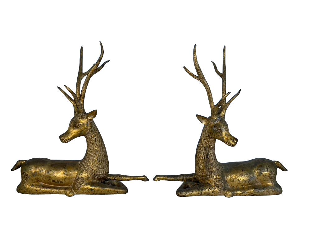 A rare pair of Thai gilt bronze Buddhist Temple deer from the 1800s. The pair are a substantial form of resting deer with superb expressions and tall antlers.  The faces have excellent detail, with etching mimicking fur around their necks.  There is