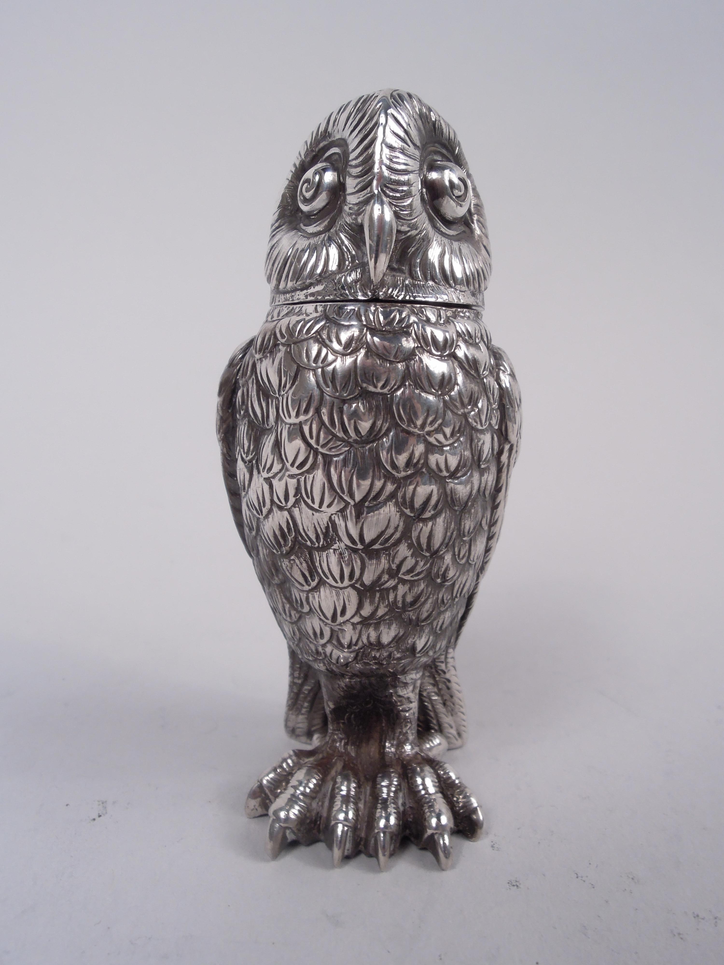 Pair of Victorian sterling silver figural owl salt and pepper shakers. Each: Erect with tucked-down wings, dense imbricated feathers, and outsized talons; bead eyes and hooked beak. Head detachable and pierced. Fully marked including maker’s stamp,