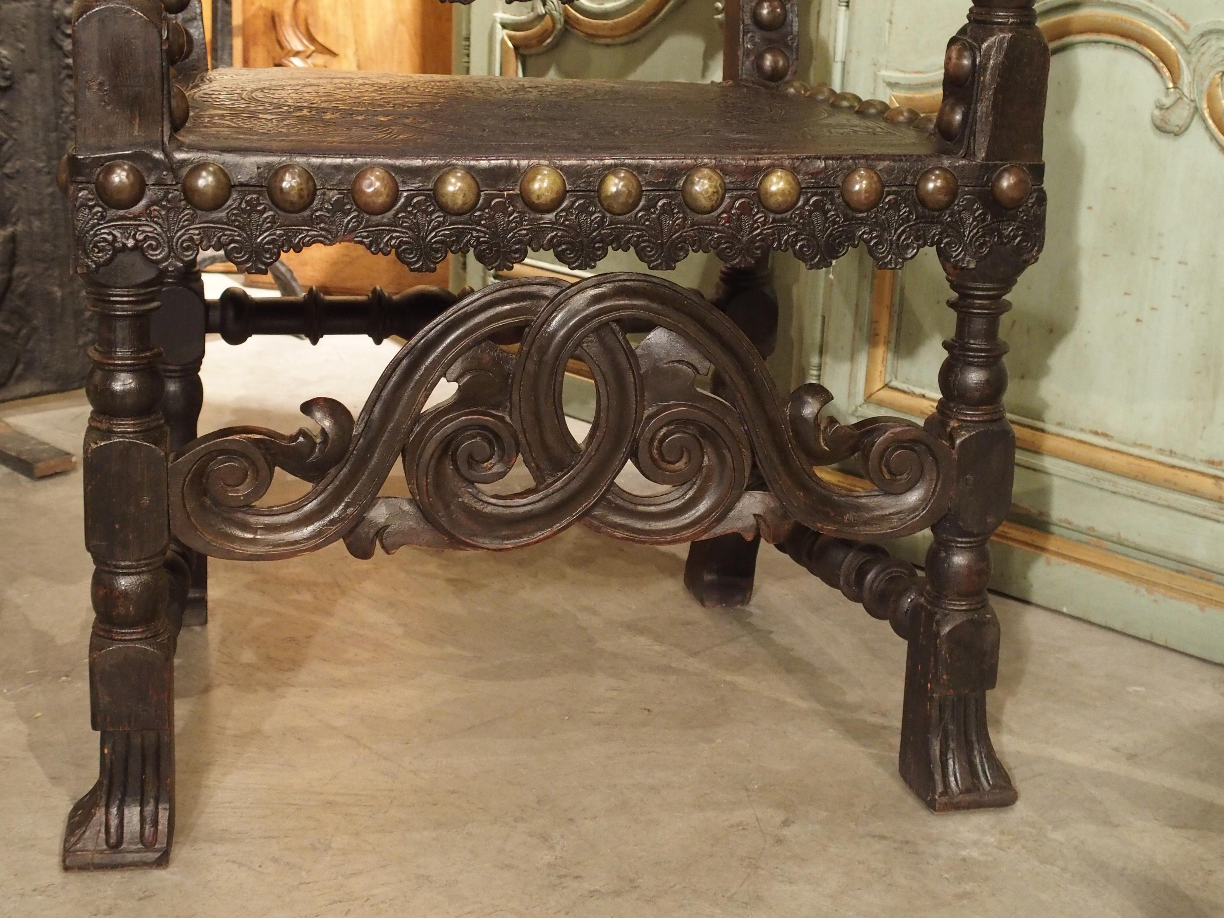 17th century and later

From Spain, these richly tooled leather and oak armchairs date to the 1600s and later. The leather is fastened to the frames with large brass nail heads, and the tooled leather is very elaborate and ornate in its designs.