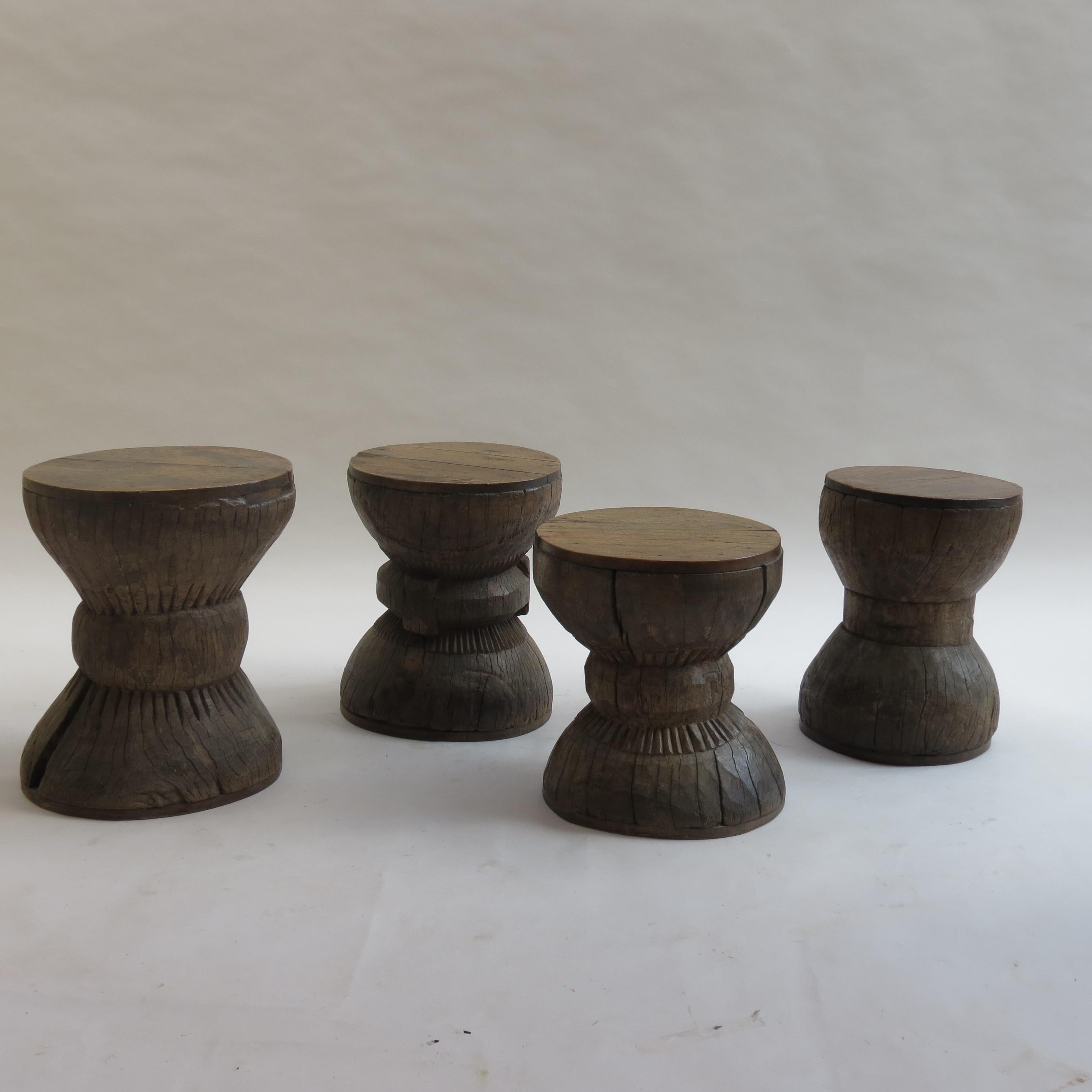 Pair of antique tribal African stool, made from hardwood with hand carved decoration from the early 20th century. Reminiscent of the Eames Timeline stools.

Very heavily patinated and worn. The wood has dried over the years to create a wonderfully