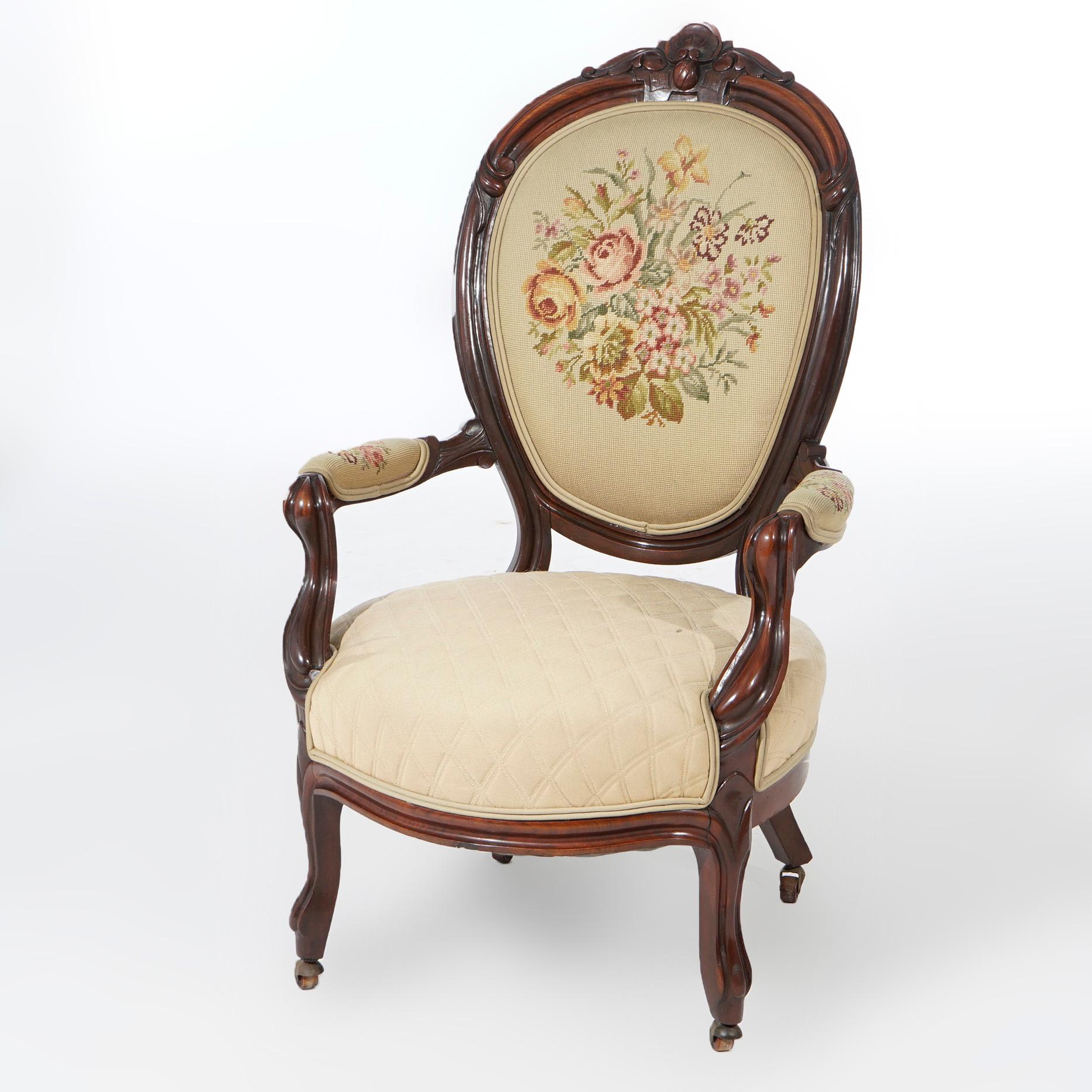 An antique parlor set offers walnut construction with carved foliate and shell crest over floral needlepoint backs and seats, raised on cabriole legs; set includes gents armchair and ladies side chair, c1890

Measures-
Ladies side chair 42'' H x