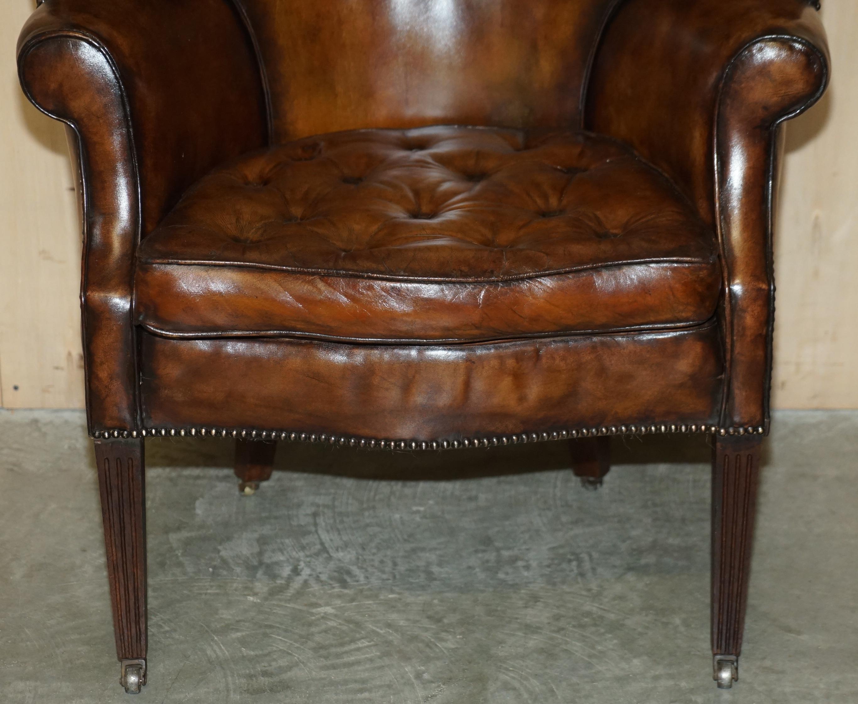 Hand-Crafted Pair of Antique Victorian Chippendale Brown Leather Porters Wingback Armchairs