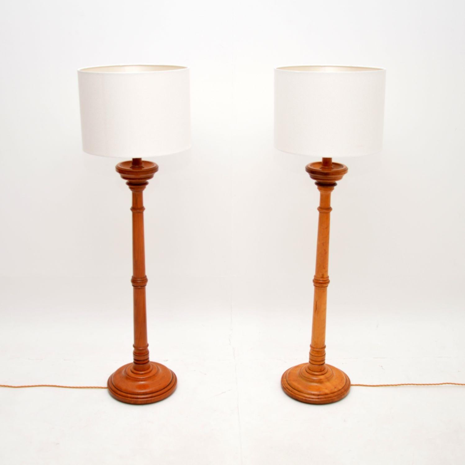 A fantastic pair of antique Victorian floor lamps. They were made in England, they date from around the 1880-1900 period.

They were probably originally large candle sticks that have been converted to electrical lamps. One is solid elm, the other is