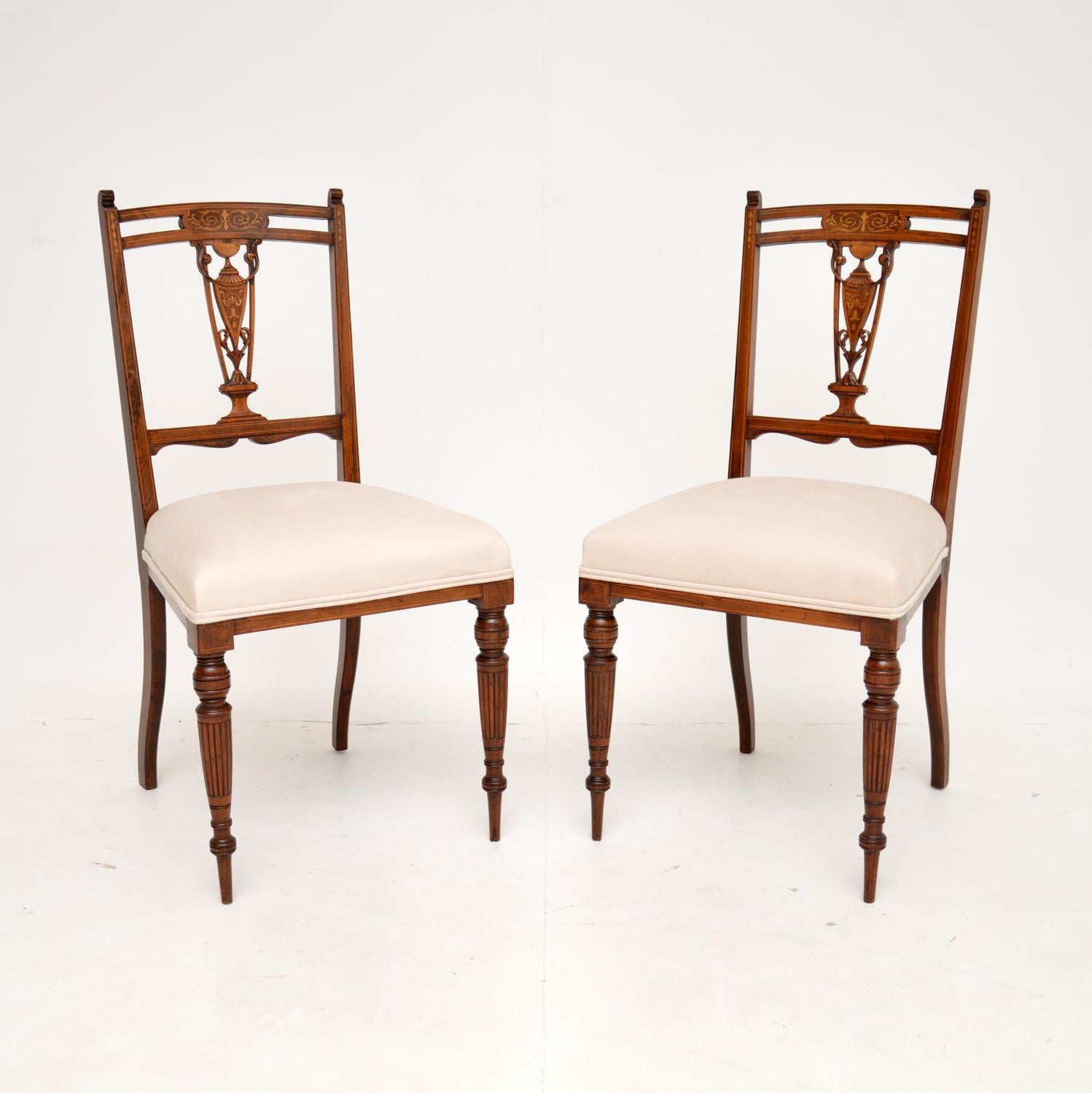 A stunning pair of antique Victorian side chairs, beautifully made from wood. They were made in England, and date from around the 1880-1890 period.

The quality is fantastic, they have incredibly fine carving on the pierced backs and the front
