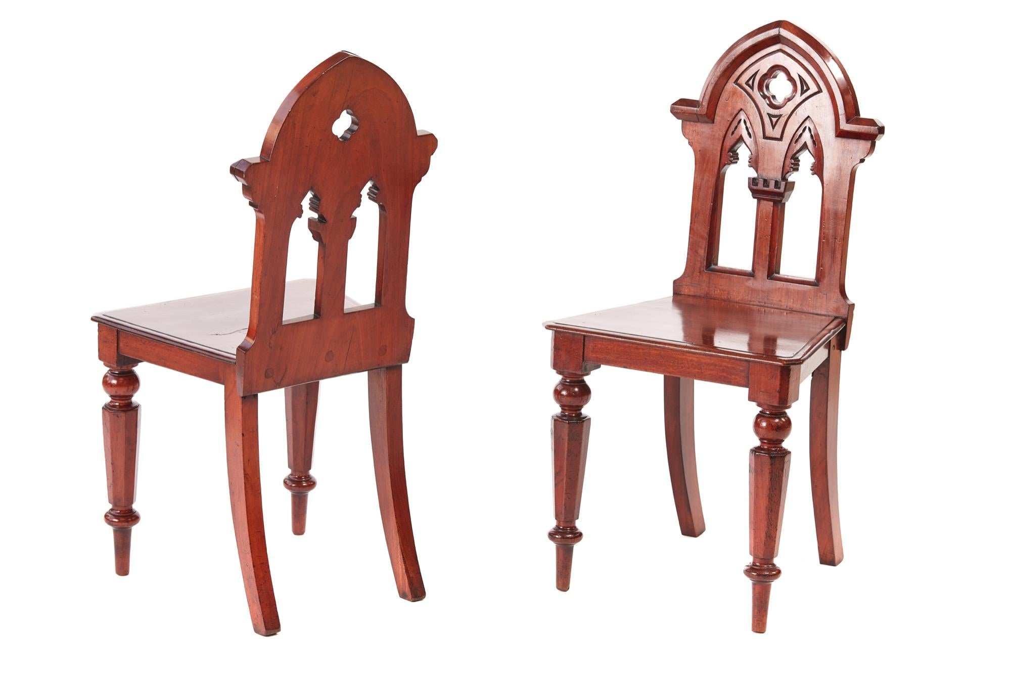 Pair of antique Victorian mahogany gothic hall chairs, with lovely shaped carved mahogany gothic backs, solid mahogany seats, standing on shaped turned legs to the front outswept back legs
Lovely color and condition
Measures: 17